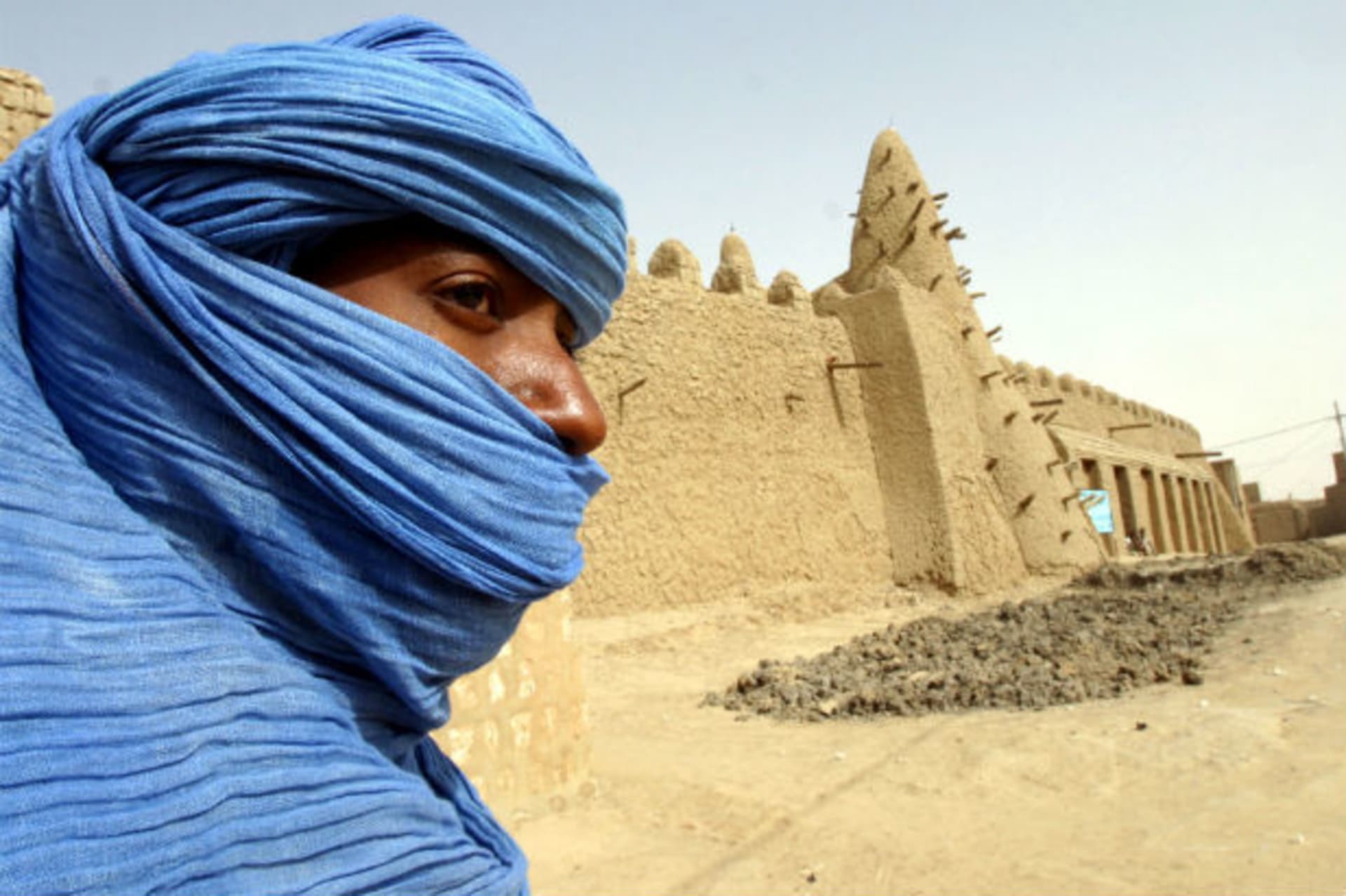 A Tuareg nomad stands near the 13th century mosque at Timbuktu, Mali, where U.S. Special Forces have been training the Malian army to better police the Sahara Desert, March 19, 2004.