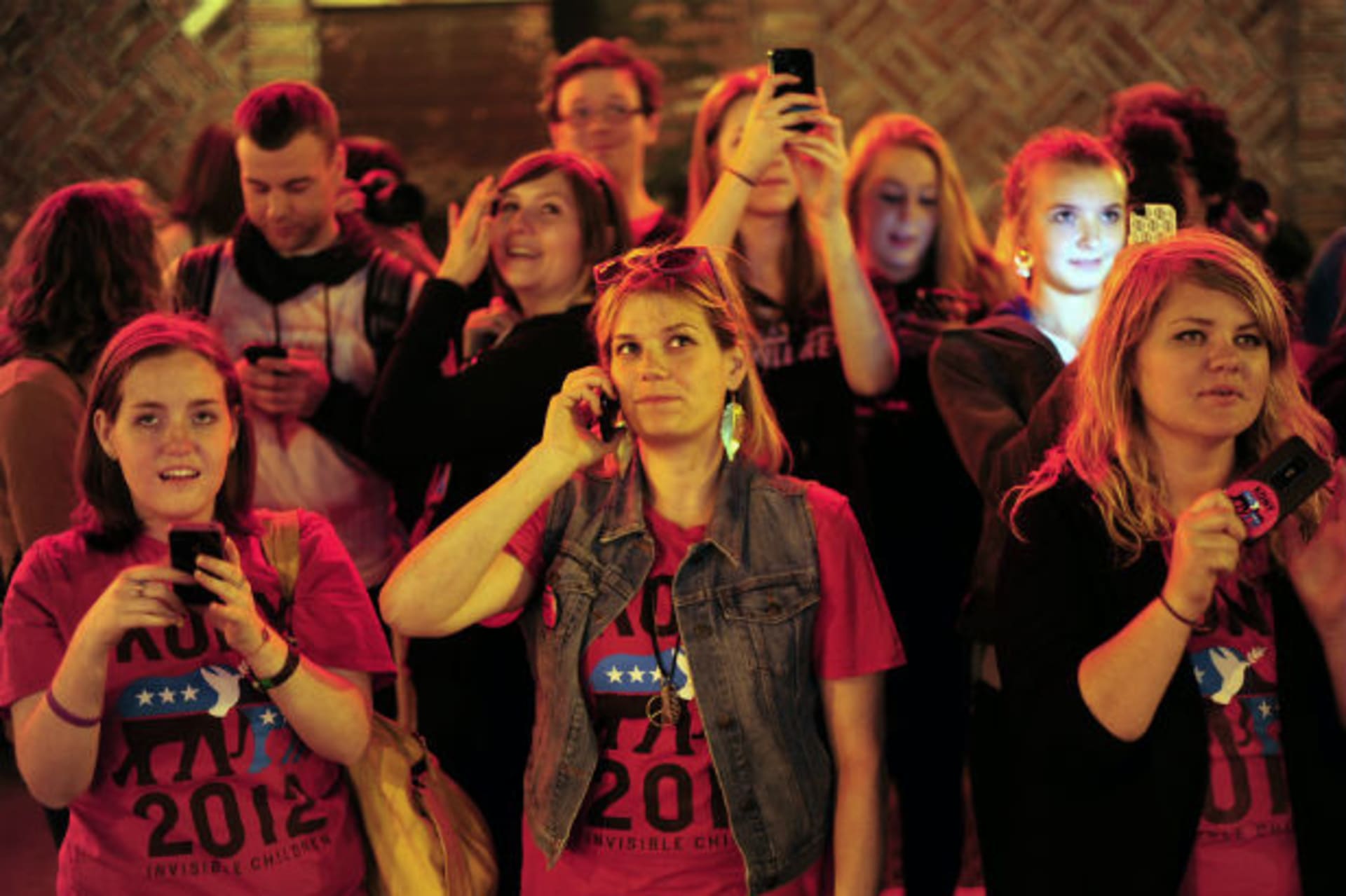 Supporters watch a projection that is part of the non-profit organization Invisible Children's "Kony 2012" viral video campaign in New York April 20, 2012.