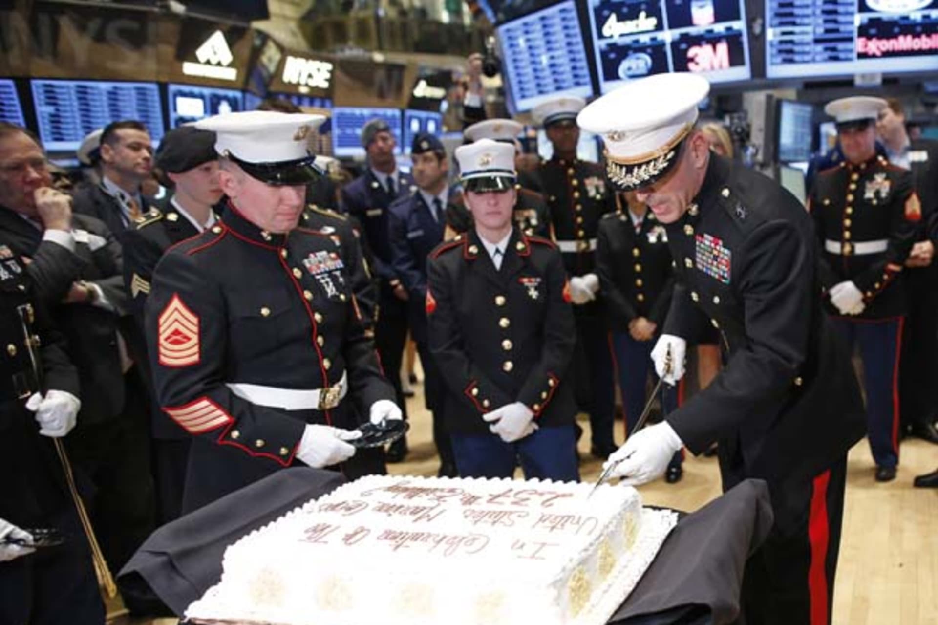 <p>U.S. Marine Corps Major General Michael Dana uses a saber to slice a cake for the Marines’ 237th birthday (Chip East/Courtesy Reuters).</p>
