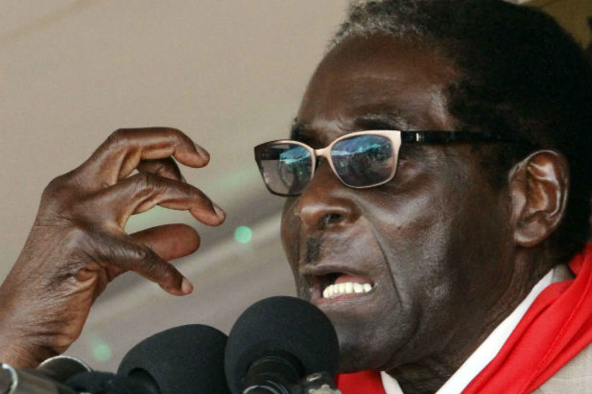 Zimbabwe's President Robert Mugabe gestures as he speaks during an event marking his 89th birthday at Chipadze stadium in Bindura, about 90 km (56 miles) north of the capital Harare March 2, 2013.