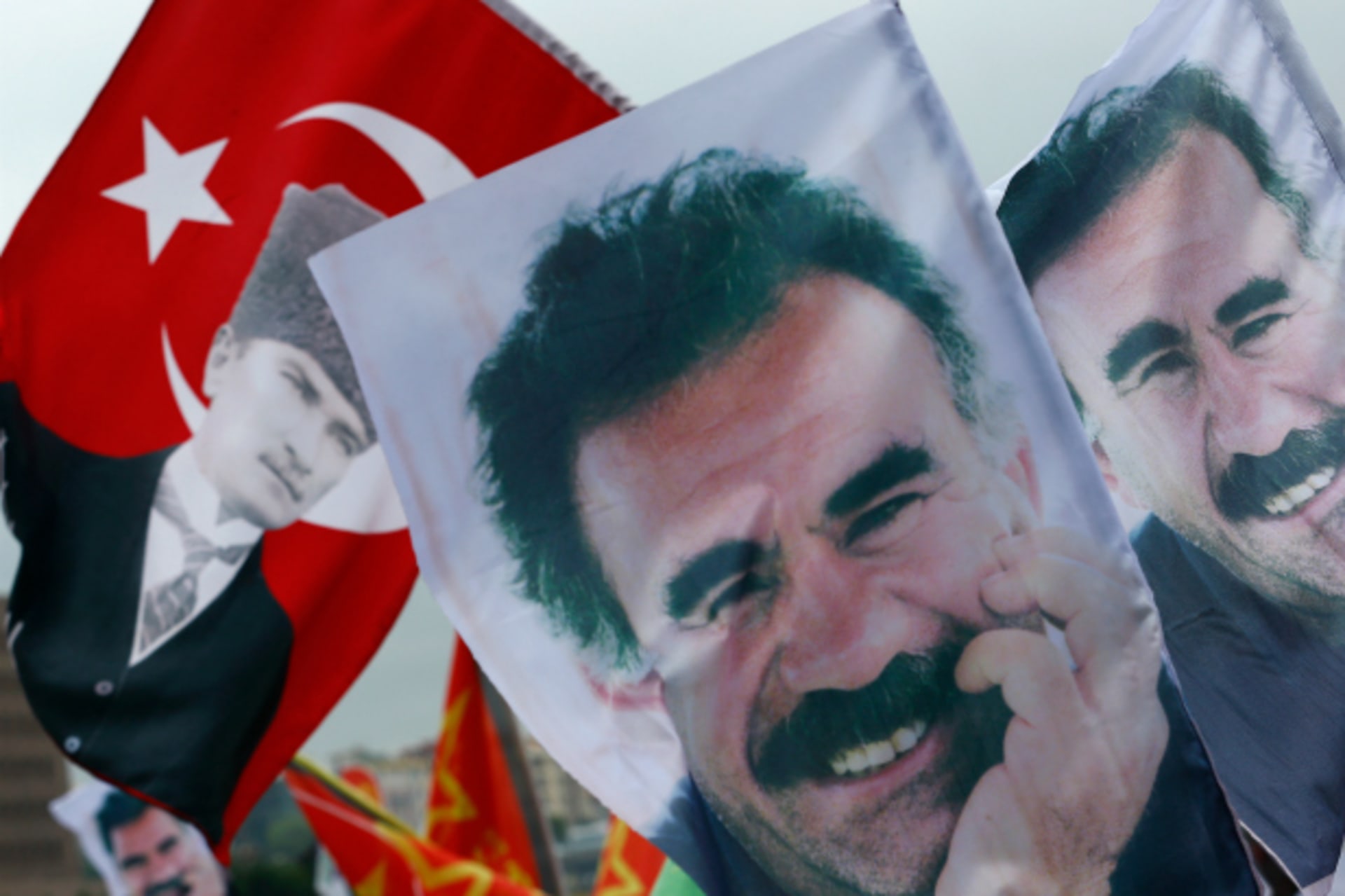 <p>Flags with a picture of the jailed Kurdish militant leader Abdullah Ocalan and of modern Turkey’s founder Mustafa Kemal Ataturk (L) are pictured during a gathering of supporters of the Pro-Kurdish Peoples’ Democratic Party (HDP) (Murad Sezer/Reuters).</p>
