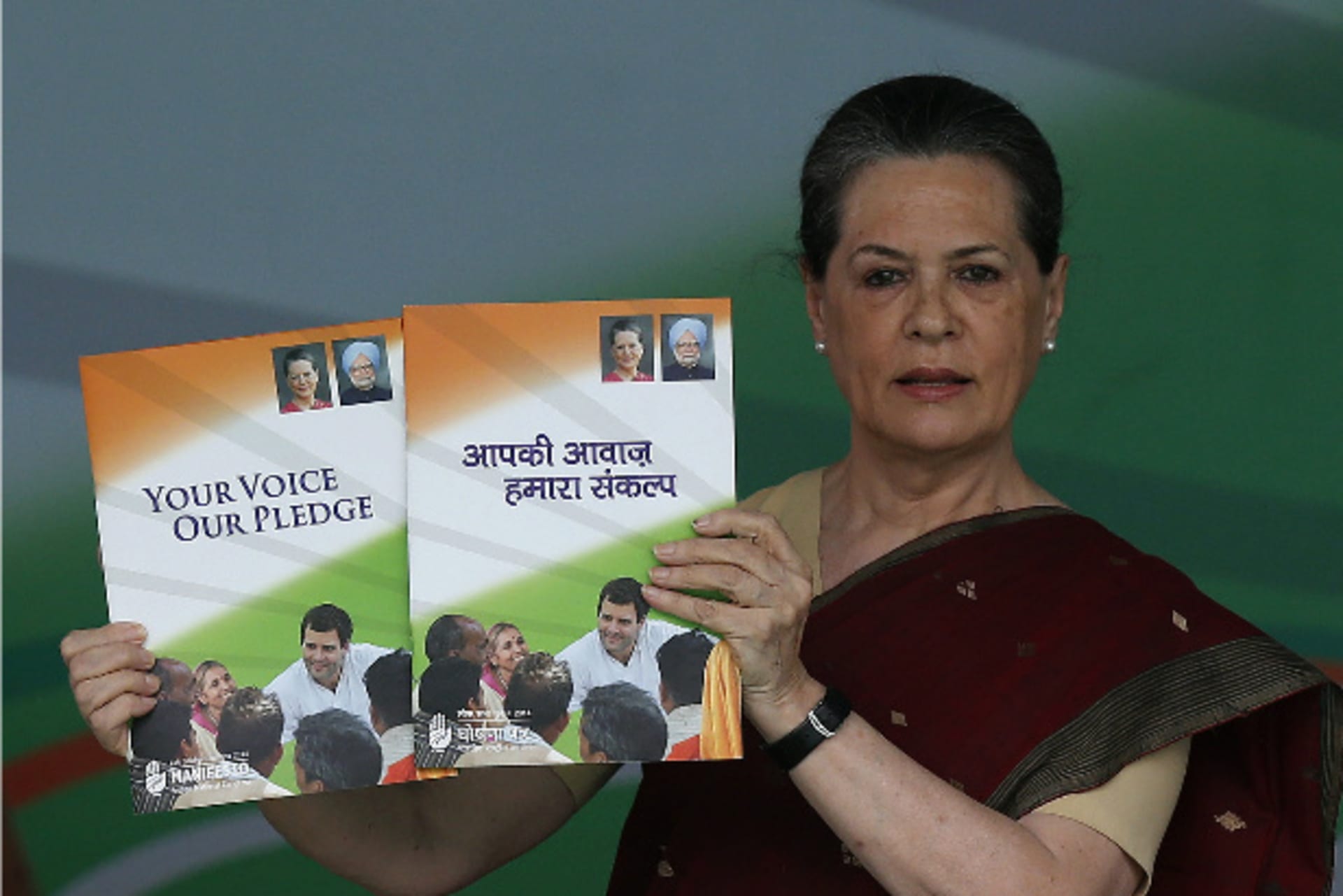 <p>Chief of India’s ruling Congress party Sonia Gandhi holds her party’s manifesto for the April/May general election in New Delhi March 26, 2014 (Adnan Abidi/Courtesy Reuters).</p>

