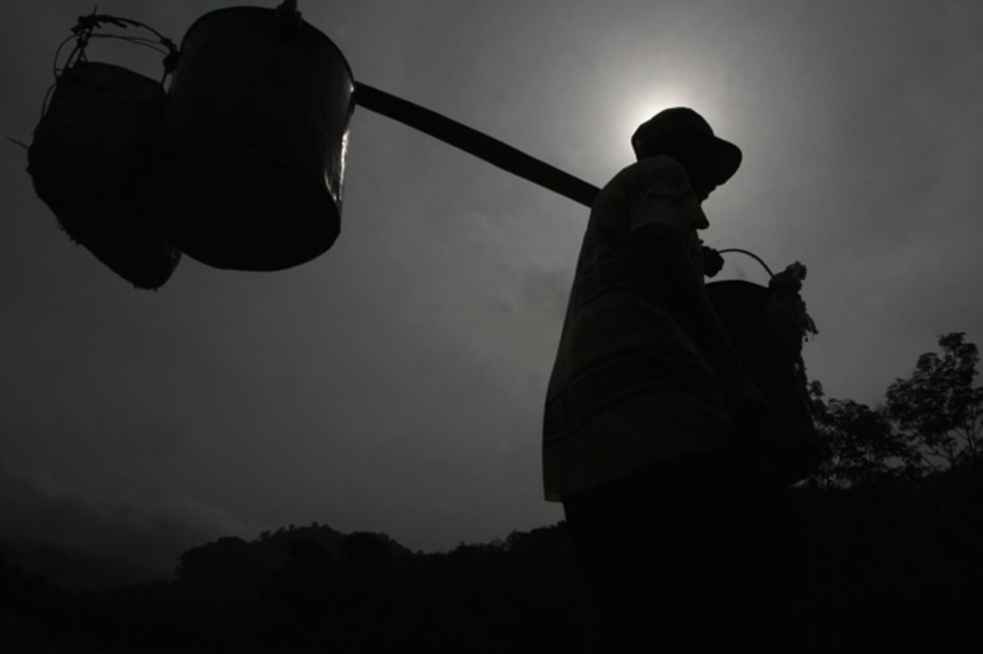 <p>A worker carries rubber latex that he collected from the state-owned plantation at Jember in Indonesia’s East Java province.</p>
