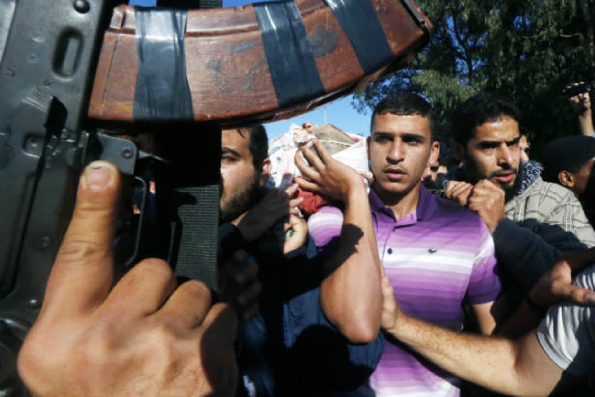 Palestinians carry the body of Ahmed Al-Jaabari, Hamas's military mastermind, during his funeral in Gaza City on November 15, 2012 (Salem/Courtesy Reuters).