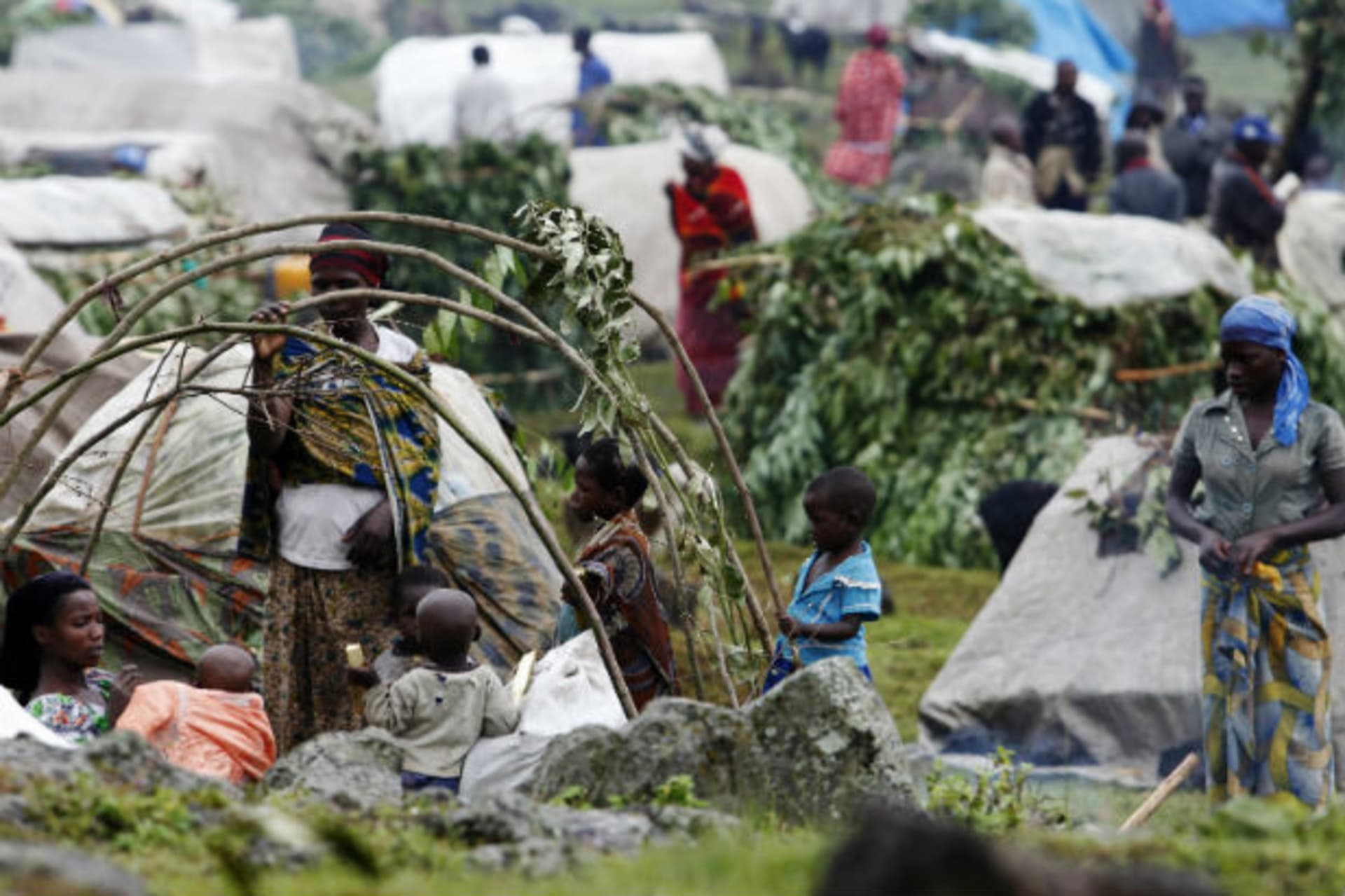 Refugees from the Democratic Republic of Congo construct makeshift shelters at a refugee camp at Bunagana near Kisoro town 521km (312 miles) southwest of Uganda capital Kampala, May 15, 2012.