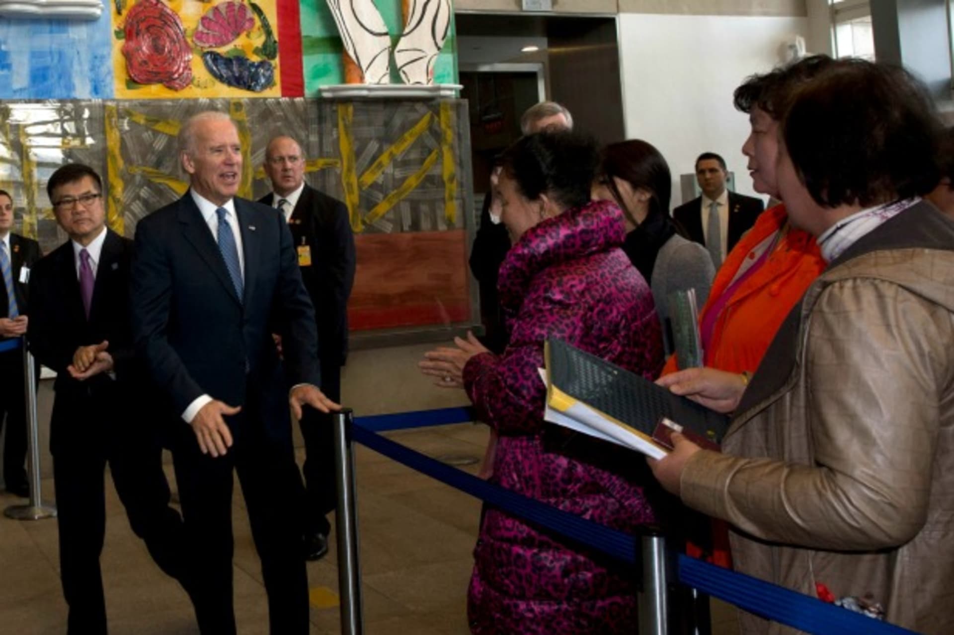 <p>U.S. Vice President Joe Biden (C) and U.S. ambassador to China Gary Locke (2nd L) meet visa applicants at the U.S. Embassy Consular Section in Beijing on December 4, 2013. (Ng Han Guan/Courtesy Reuters)</p>
