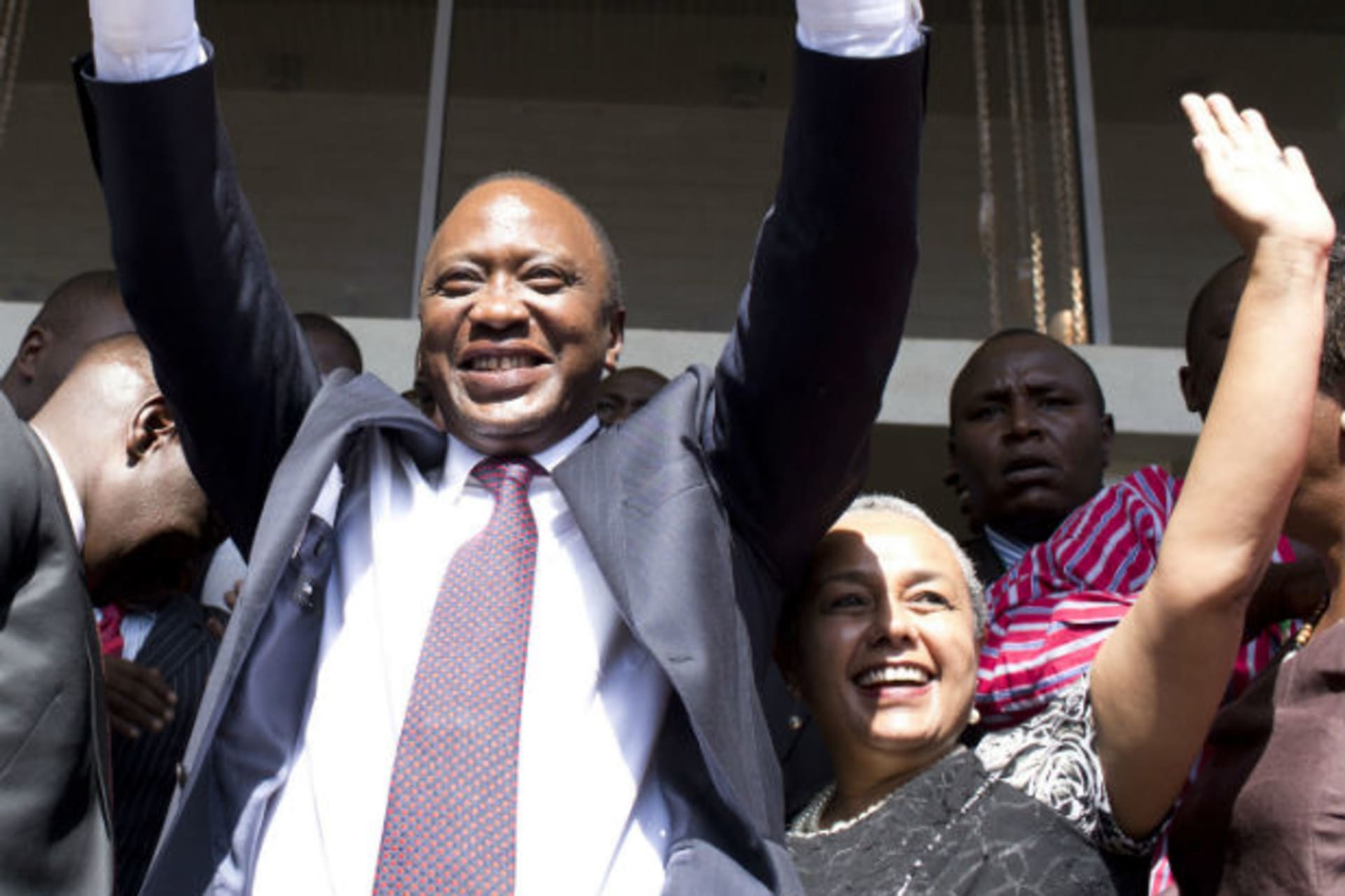 President-elect Uhuru Kenyatta greets his supporters in the company of his wife Margaret, soon after attending a news conference in Nairobi March 9, 2013.