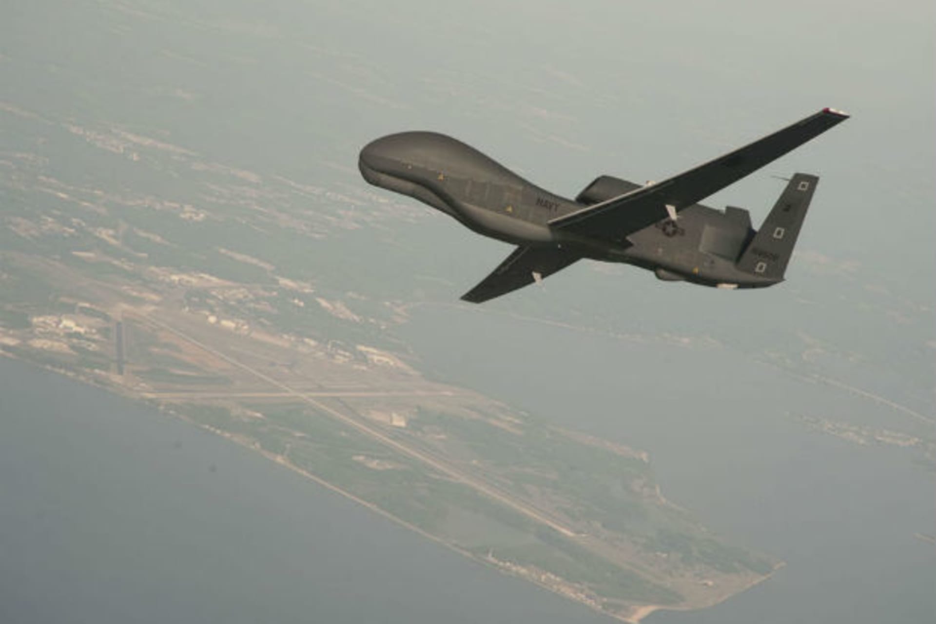 Undated file photo courtesy of the U.S. Navy shows a RQ-4 Global Hawk unmanned aerial vehicle conducting tests over Naval Air Station Patuxent River, Maryland.