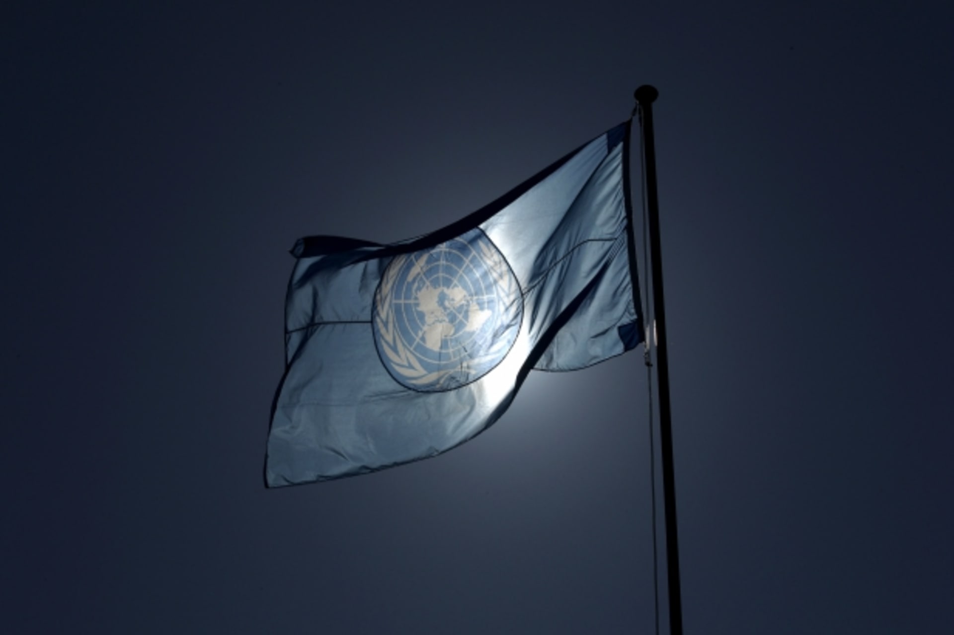 <p>A United Nations flag flies on a mast at their European headquarters in Geneva. (Denis Balibouse/Reuters)</p>
