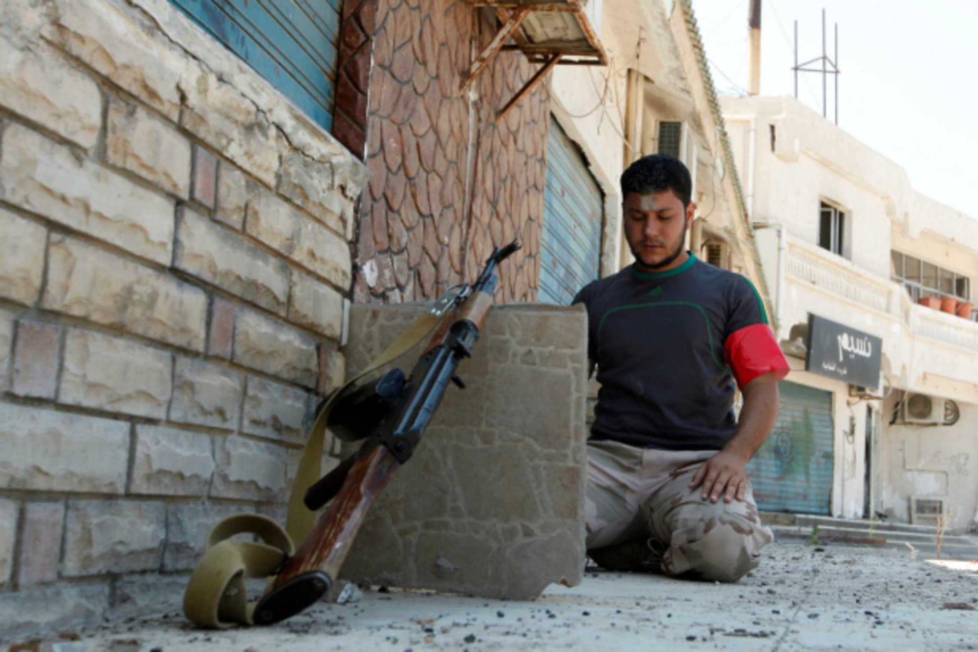 <p>A member of Libyan forces prays as he prepares with his comrades for next advance against Islamic State holdouts in Sirte, Libya (Ismail Zitouny/Reuters).</p>
