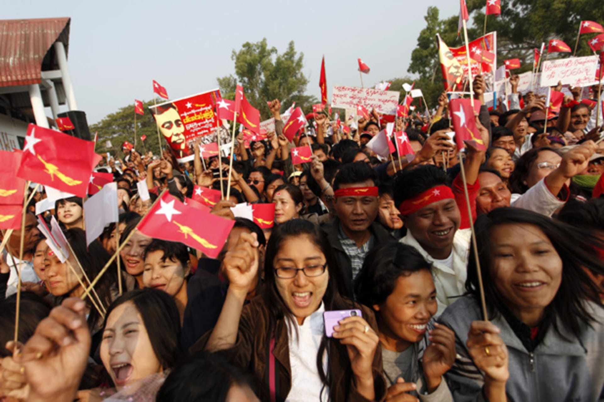 <p>Supporters wave the National League for Democracy party’s flag during pro-democracy leader Aung San Suu Kyi’s speech at Kachin National Manu park in the capital city Myitkyina, Kachin state.</p>