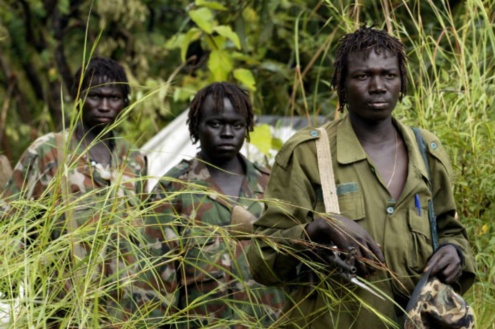 Lords Resistance Army (LRA) fighters arrive at an assembly point in Owiny Ki Bul, 160km (100 miles) south of Juba, Sudan, September 19, 2006.