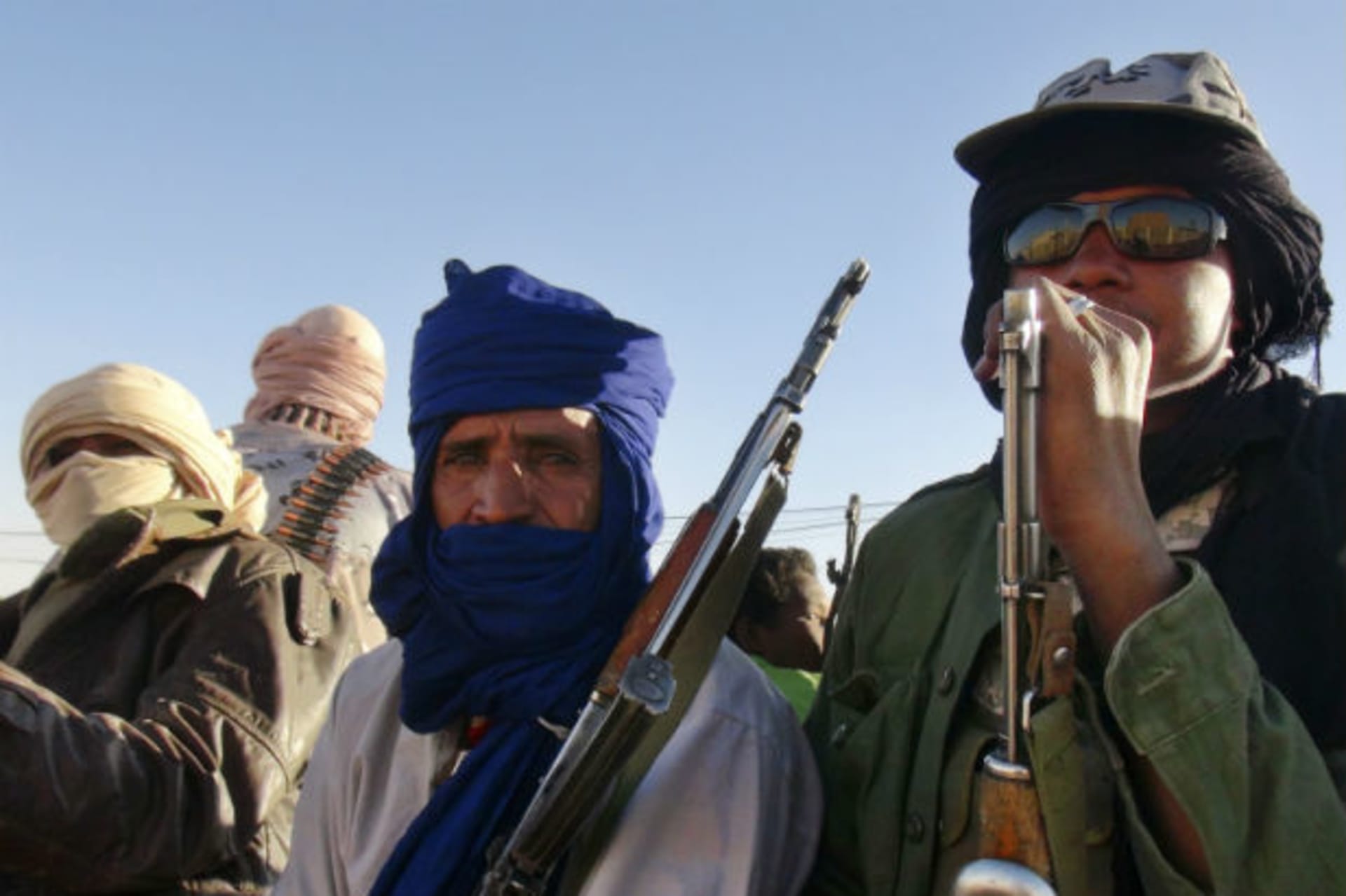 Soldiers from the Tuareg rebel group MNLA sit in a pickup truck in the northeastern town of Kidal February 4, 2013.