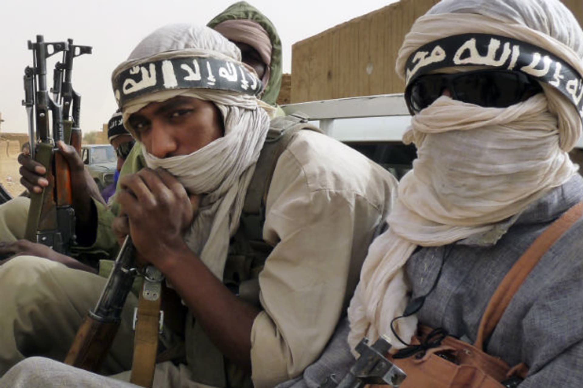 <p>Militiaman from the Ansar Dine Islamic group, who said they had come from Niger and Mauritania, ride on a vehicle at Kidal in northeastern Mali, June 16, 2012. (Stringer/Courtesy Reuters)</p>
