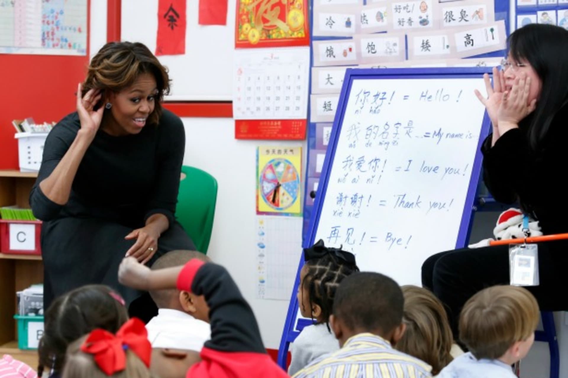<p>U.S. first lady Michelle Obama (L) participates in a language class with teacher Crystal Chen for pre-school students at the W…Ying Public Charter School ahead of her upcoming trip to China, in Washington on March 4, 2014. (Yuri Gripas/Courtesy Reuters)</p>
