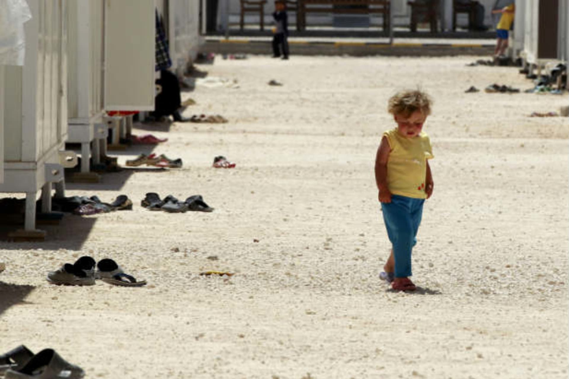 A Syrian refugee girl walks inside the Mrajeeb Al Fhood refugee camp, 20 km (12.4 miles) east of the city of Zarqa April 29, 2013 (Hamed/Courtesy Reuters)..