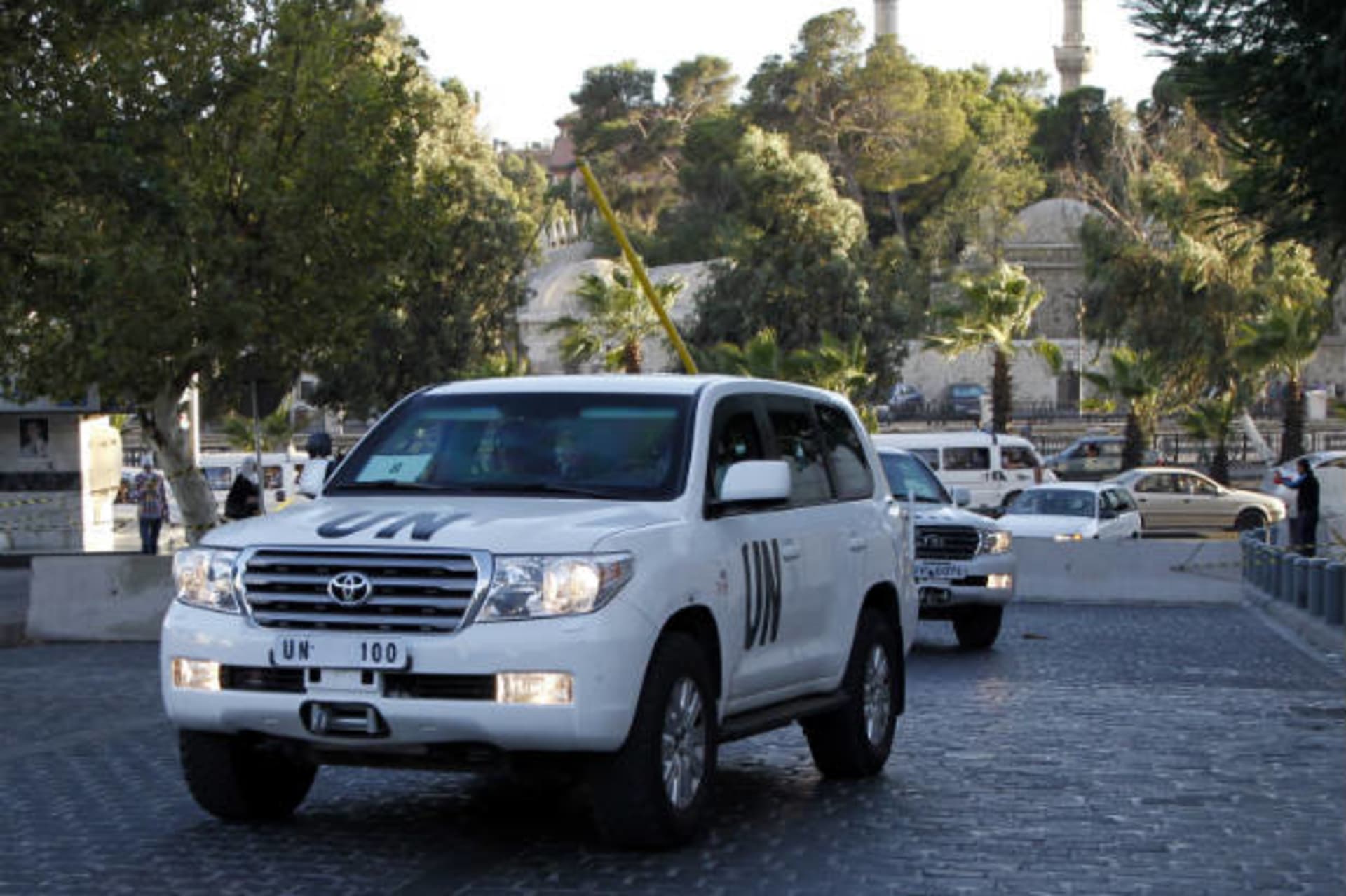 UN vehicles transporting a team of experts from the Organization for the Prohibition of Chemical Weapons are pictured as they return to their hotel in Damascus October 3, 2013 (al-Hariri/Courtesy Reuters).