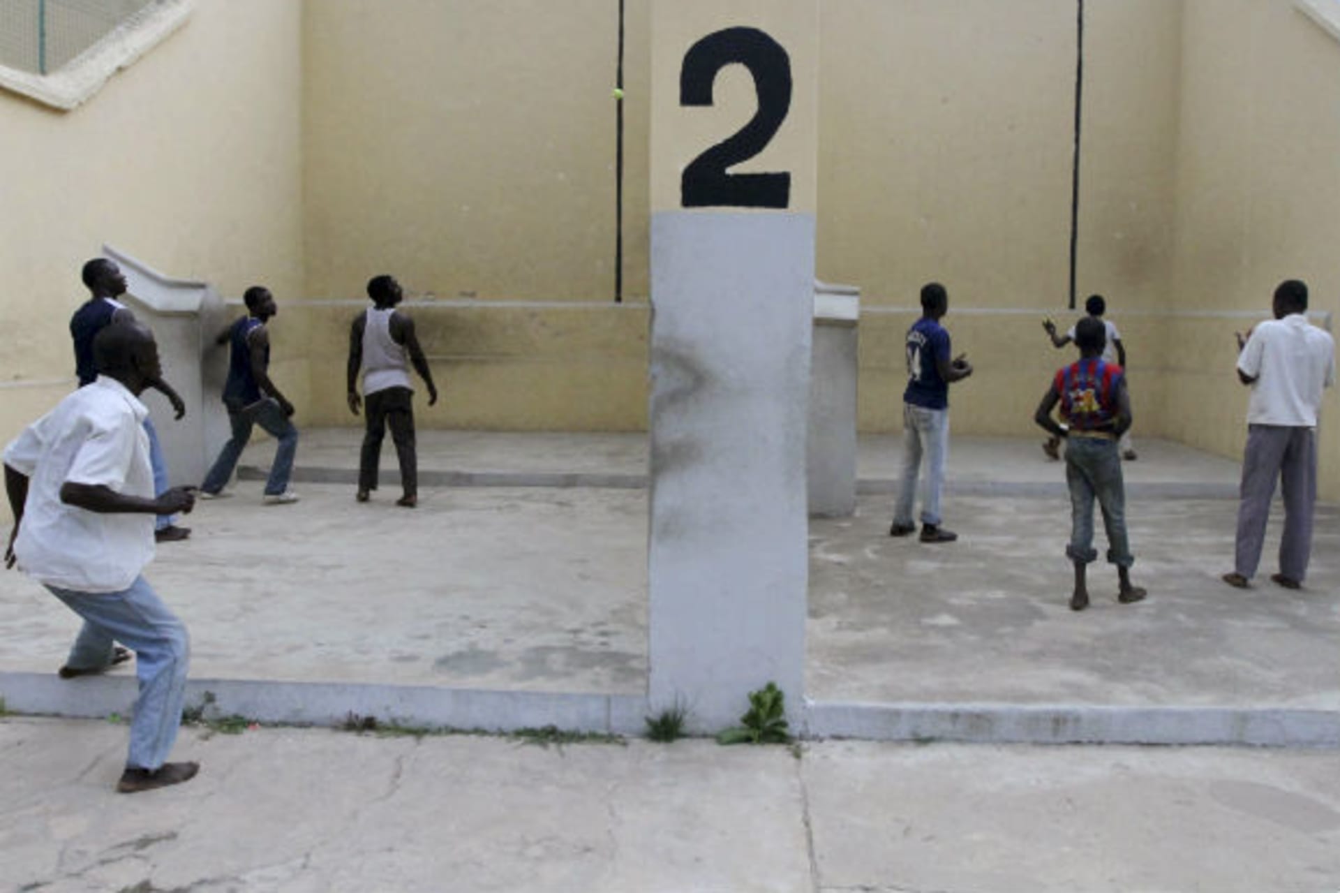 Youths play Eton fives game in a court in Nigeria's northern city of Kano September 6, 2011.