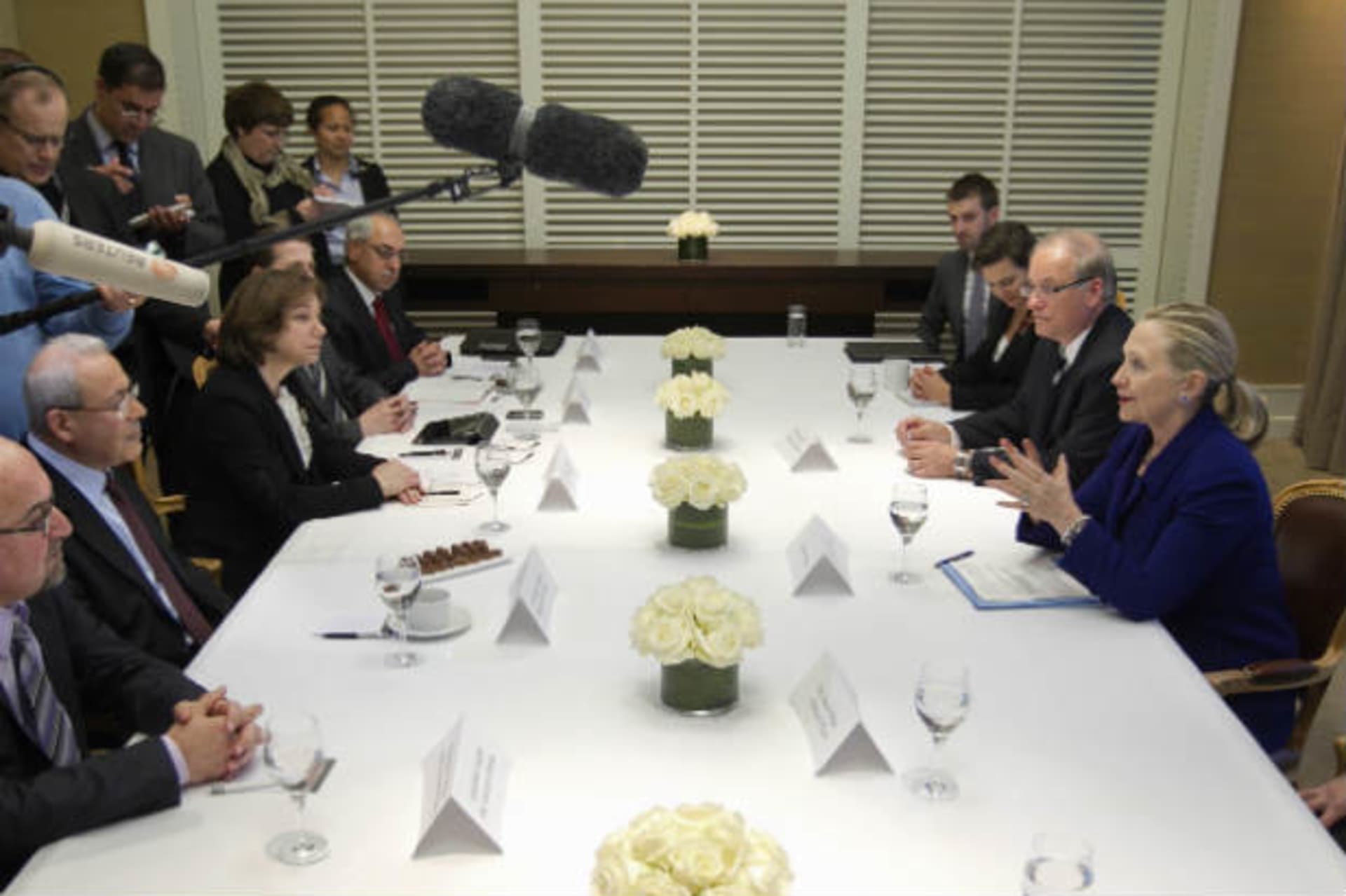 U.S. secretary of state Clinton meets with a small group of expatriate Syrian opposition members at a hotel in Geneva on December 6, 2011 (Applewhite/Courtesy Reuters).