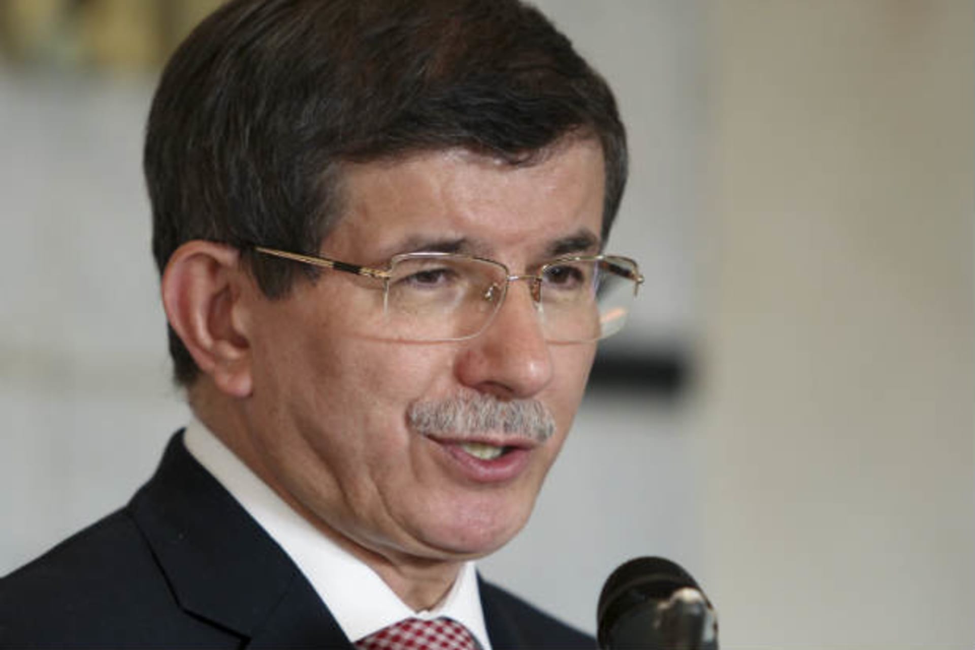 Turkish foreign minister Ahmet Davutoglu speaks with reporters during a news conference (al-Sayaghi/Courtesy Reuters).
