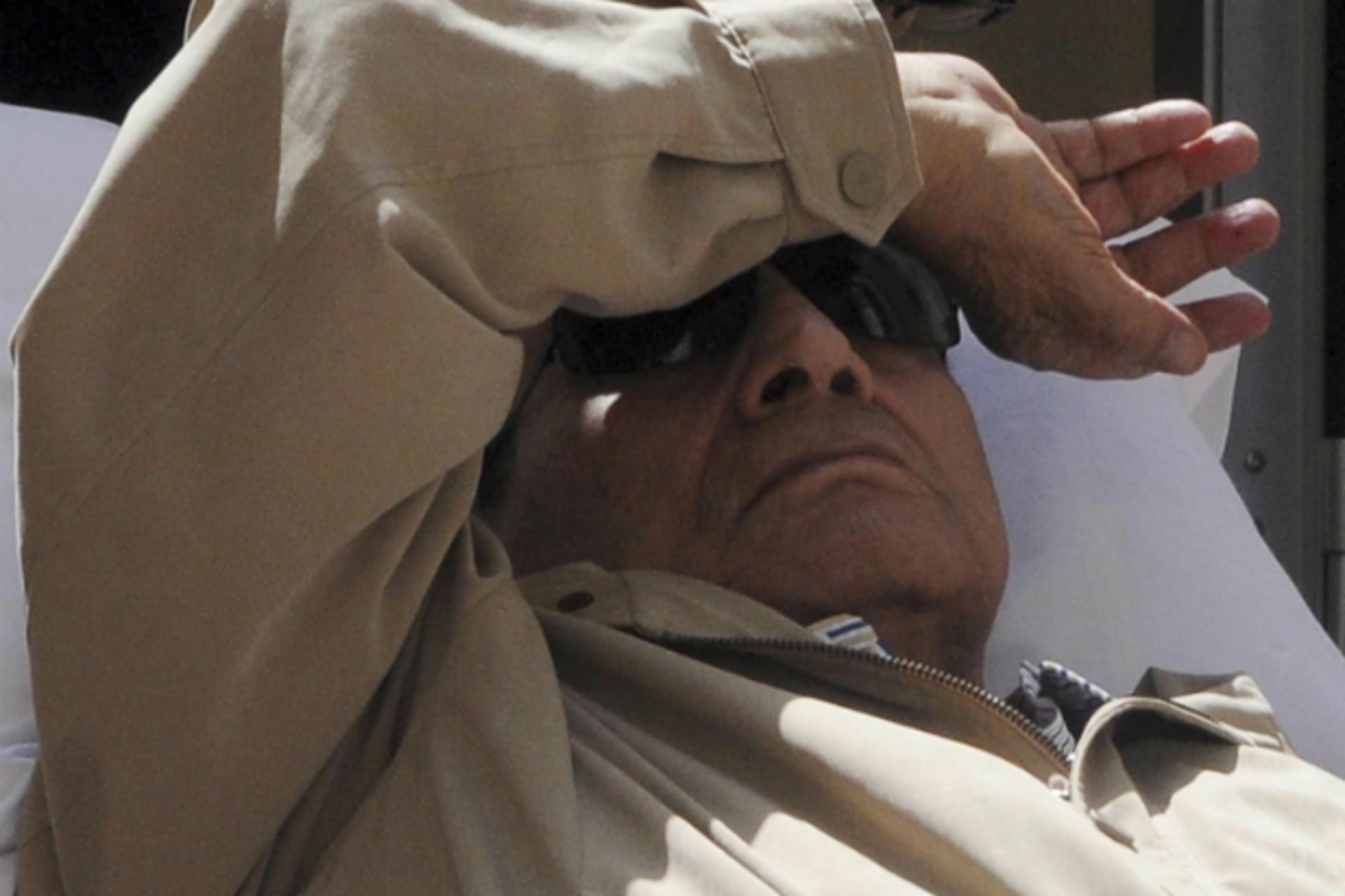 <p>Former Egyptian President Hosni Mubarak is wheeled out of the courtroom in Cairo</p>
