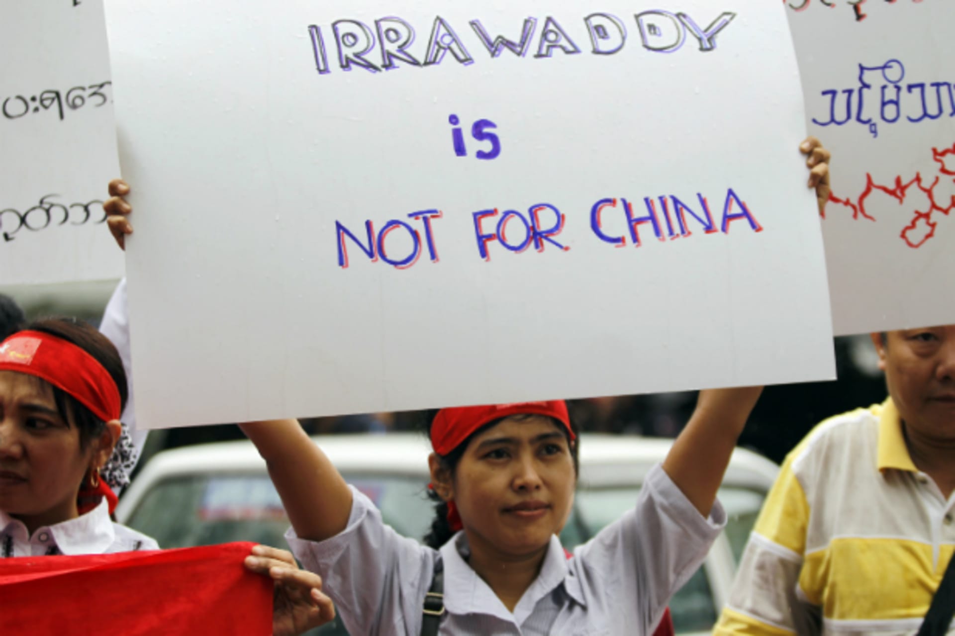 <p>Myanmareses living in Malaysia display placards in protest against the Myitsone dam project, outside Myanmar embassy in Kuala Lumpur on September 22, 2011. (Bazuki Muhammad/Courtesy Reuters)</p>
