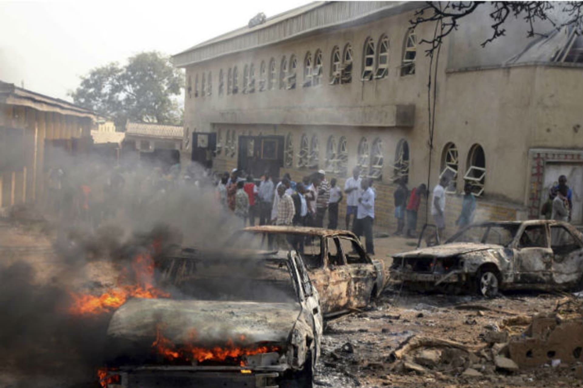 A car burns at the scene of a bomb explosion at St. Theresa Catholic Church at Madalla 25/12/2011.
