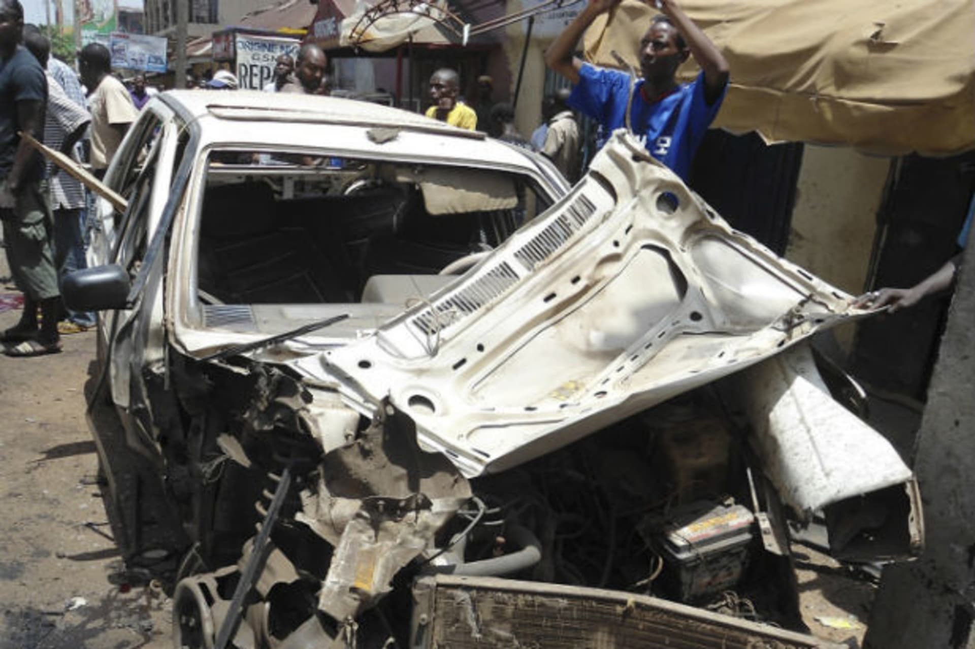 The wreckage of a car is pictured after a bomb blast in front of the office compound of Nigerian newspaper This Day in the northern city of Kaduna April 26, 2012.