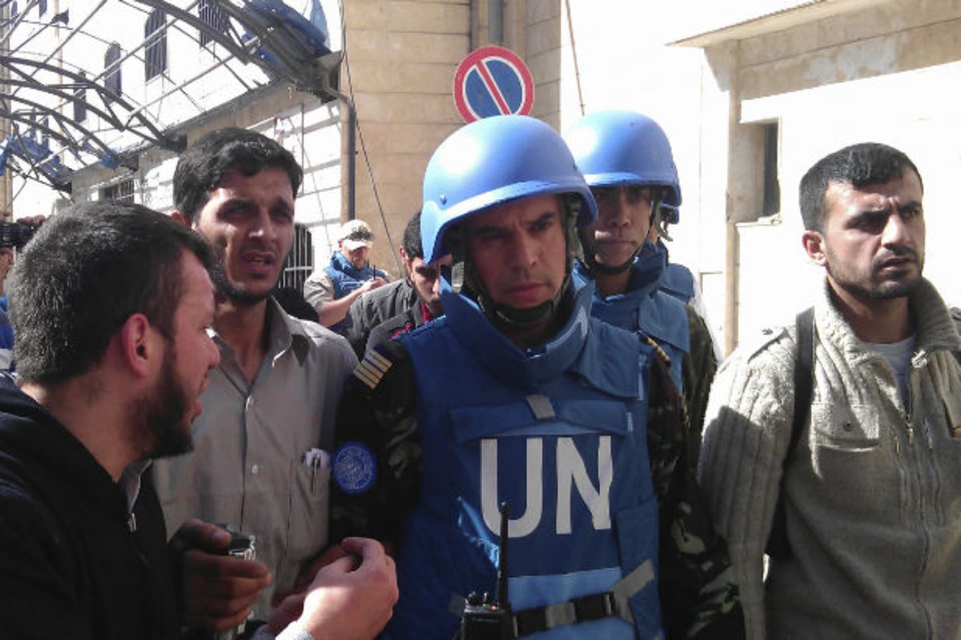 Members of the first U.N. monitoring team in Syria, together with members of the Syrian Free Army, visit Homs on April 21, 2012.