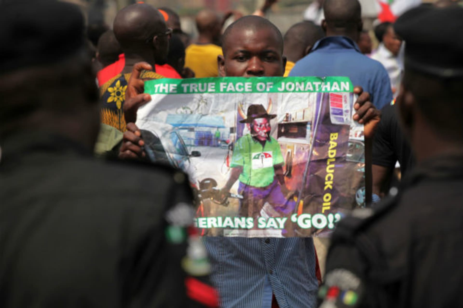 A protester holds a placard on the fourth day of a nationwide strike against the removal of the petrol subsidy in Lagos January 12, 2012.