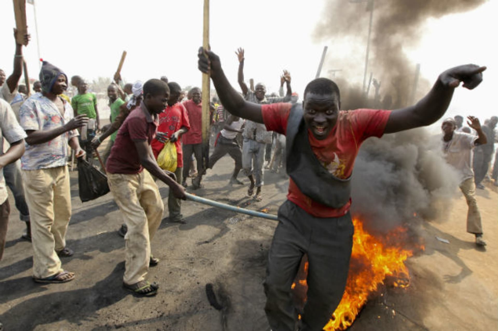 Demonstrators gather at a burning barricade during a protest against the elimination of a popular fuel subsidy that has doubled the price of petrol, at Gwagwalada on the outskirts of Nigeria's capital Abuja January 9, 2012