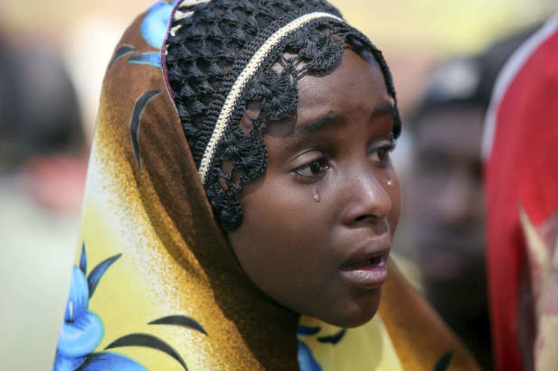 A girl cries at an internally displaced persons camp in Nigeria's central city of Jos, January 20, 2010. (Akintunde Akinleye/Courtesy Reuters)