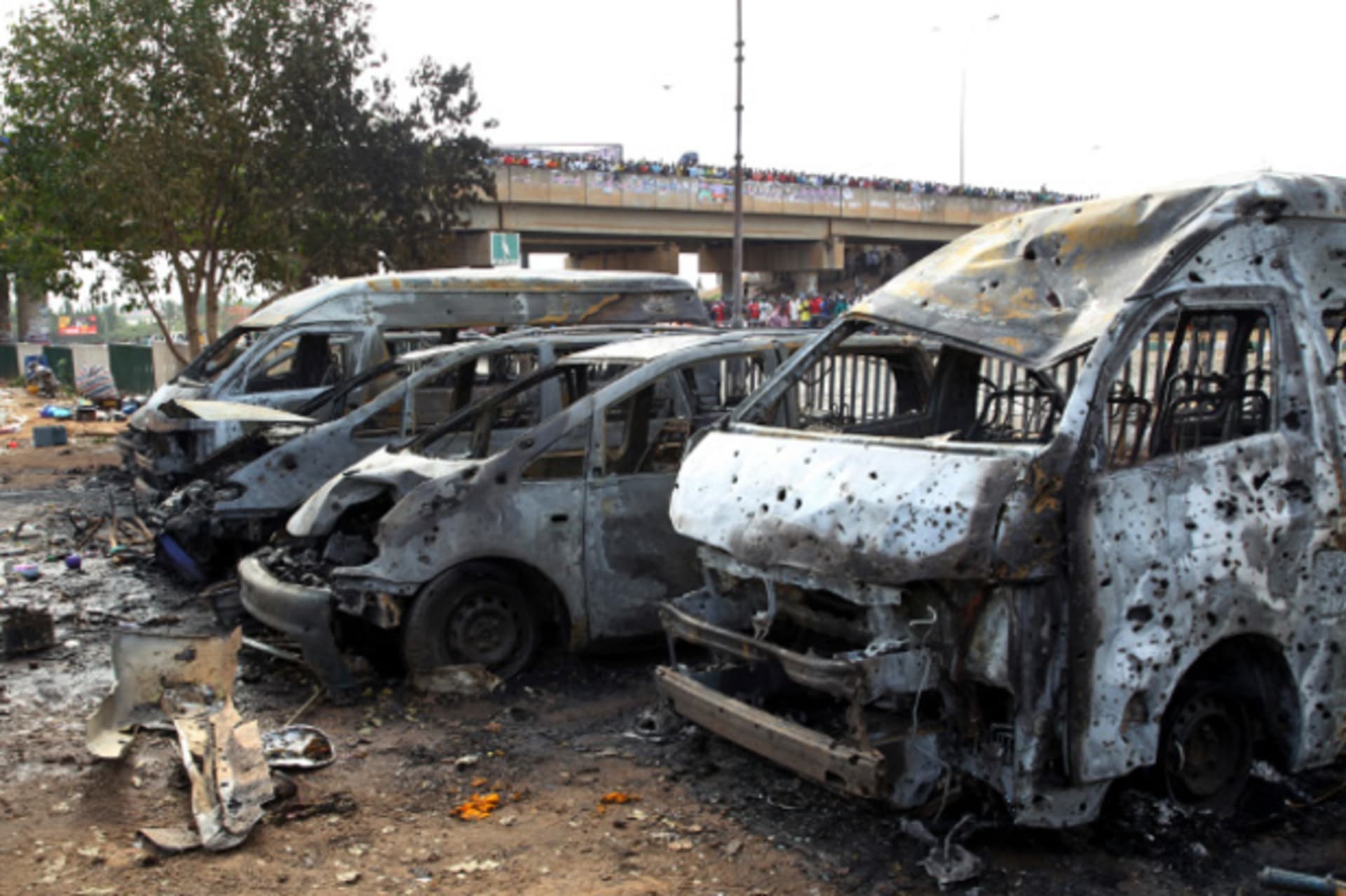 Burnt and damaged vehicles are seen at the scene of the bomb blast explosion at Nyanyan, Abuja April 14, 2014.