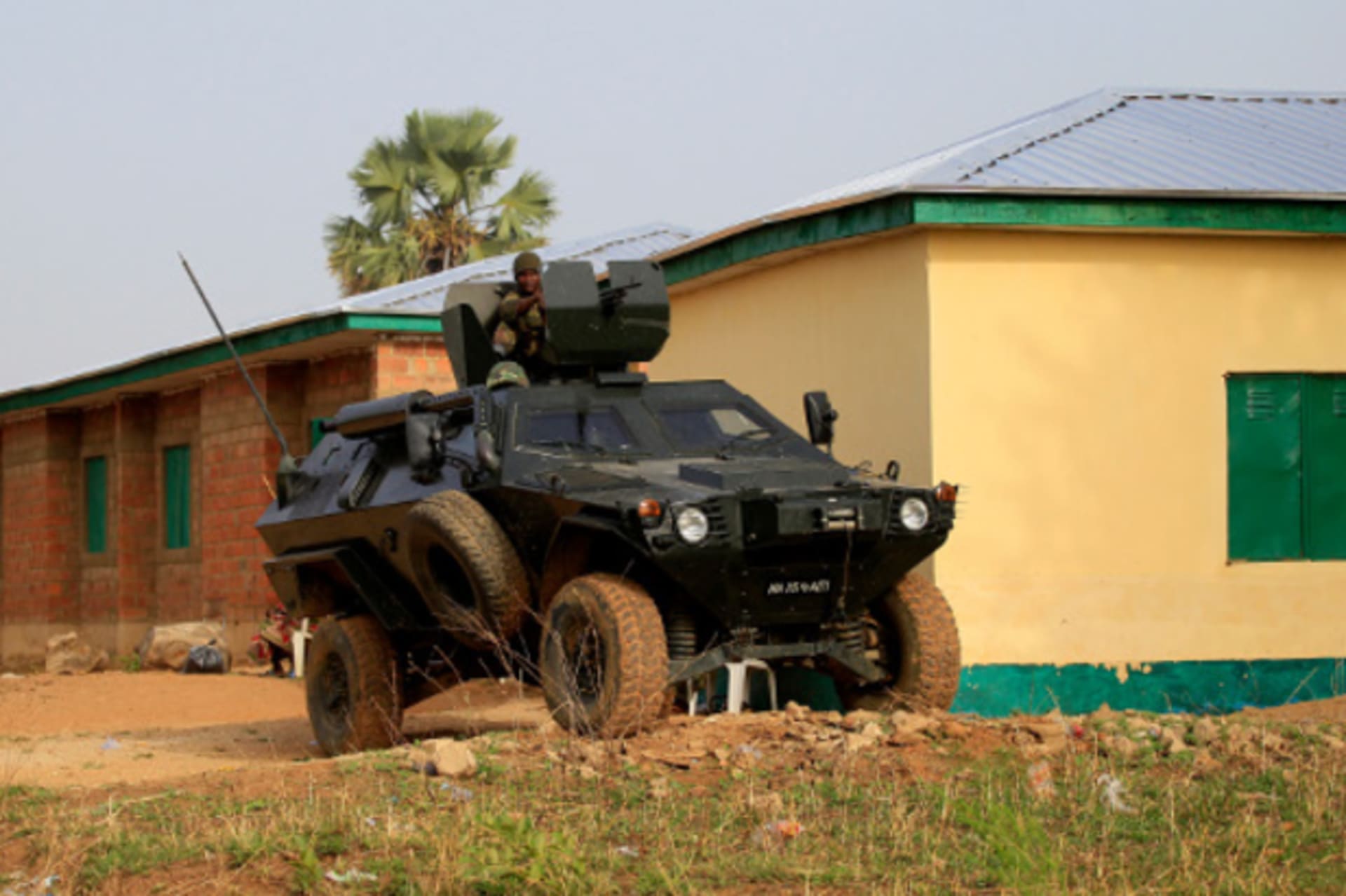 An army vehicle is seen parked at the entrance of the LEA primary school refugee centre, following a raid by gunmen who killed over 100 people last Friday at Angwan Gata, Kaura local government Kaduna State, March 20, 2014.