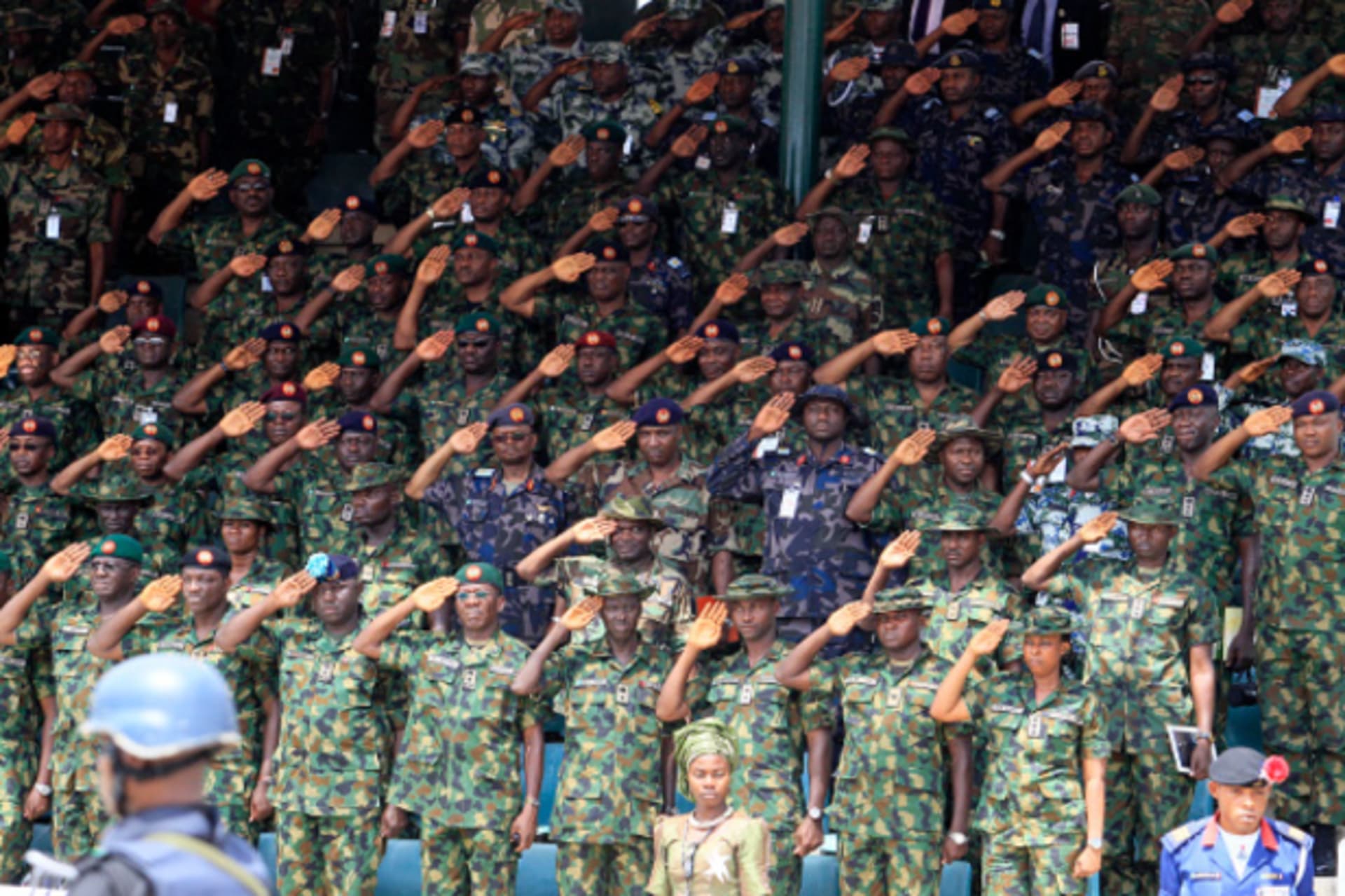 Commanding officers salute during a parade for the Nigeria Army's 150th anniversary celebration in Abuja July 6, 2013.