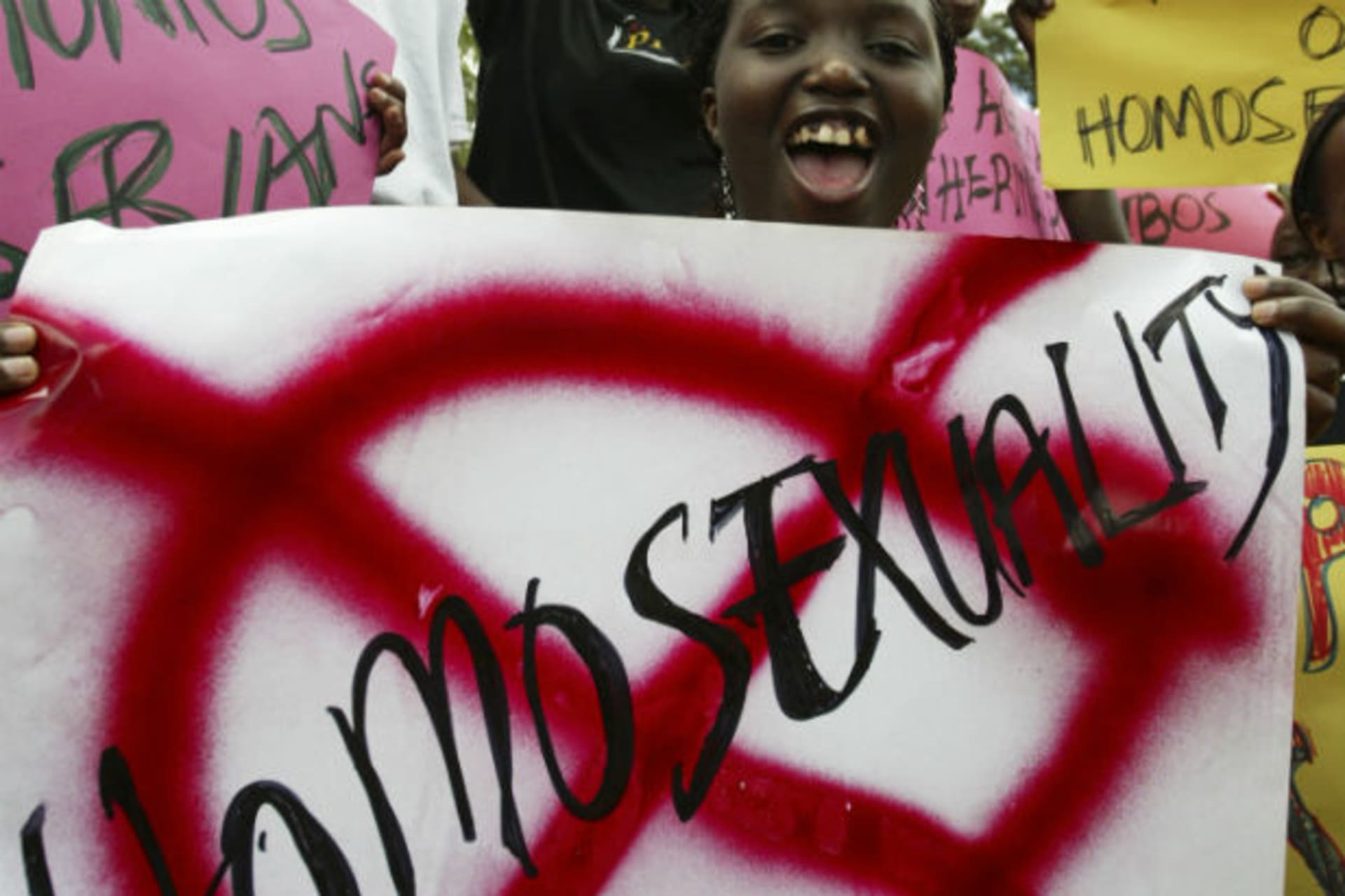 Members of religious groups campaigning against homosexuality hold placards during a rally in Kampala August 21, 2007.