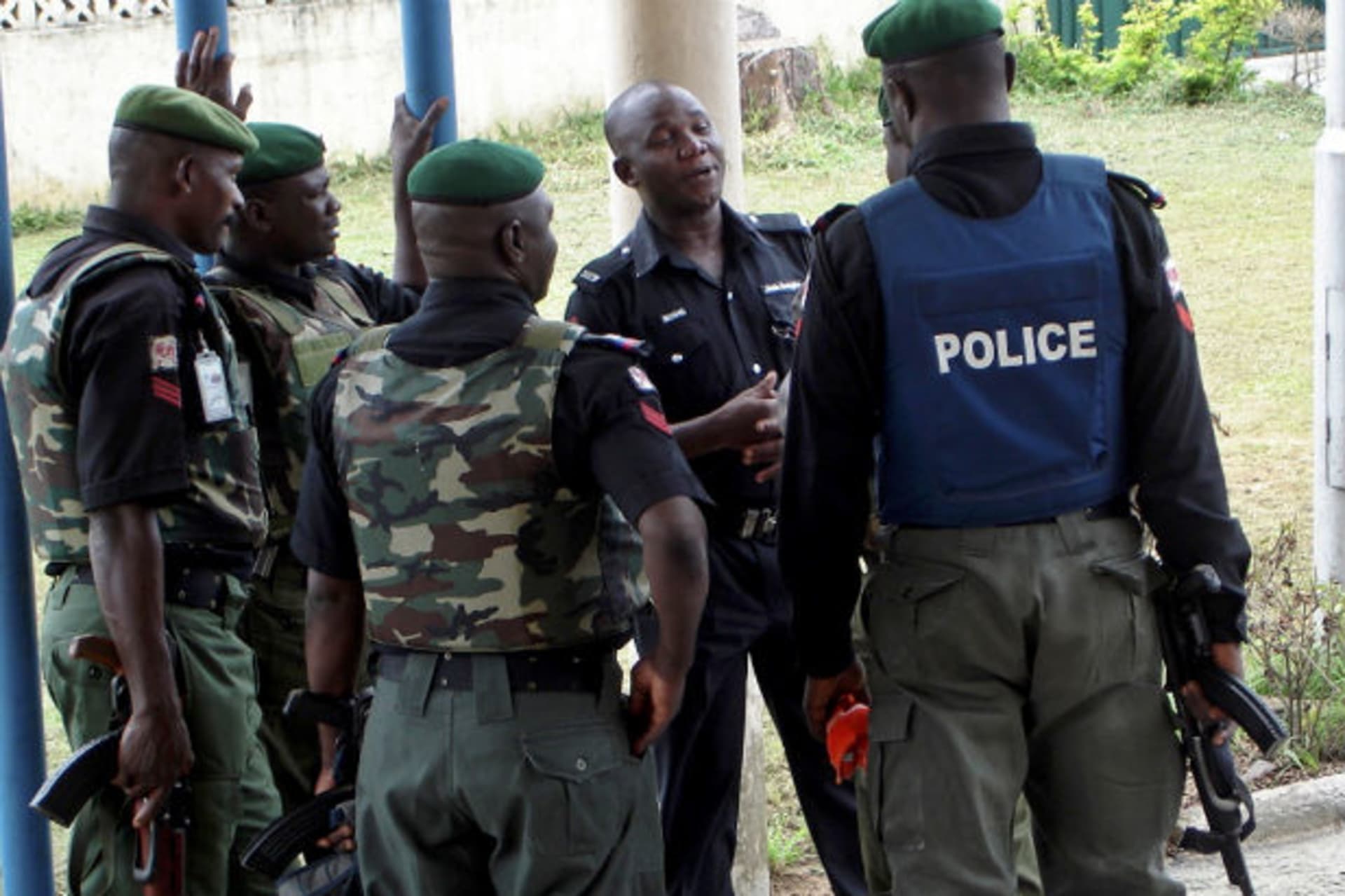 Nigerian policemen await the arrival of Inspector-General of Police Mike Okiro in Port Harcourt July 6, 2007