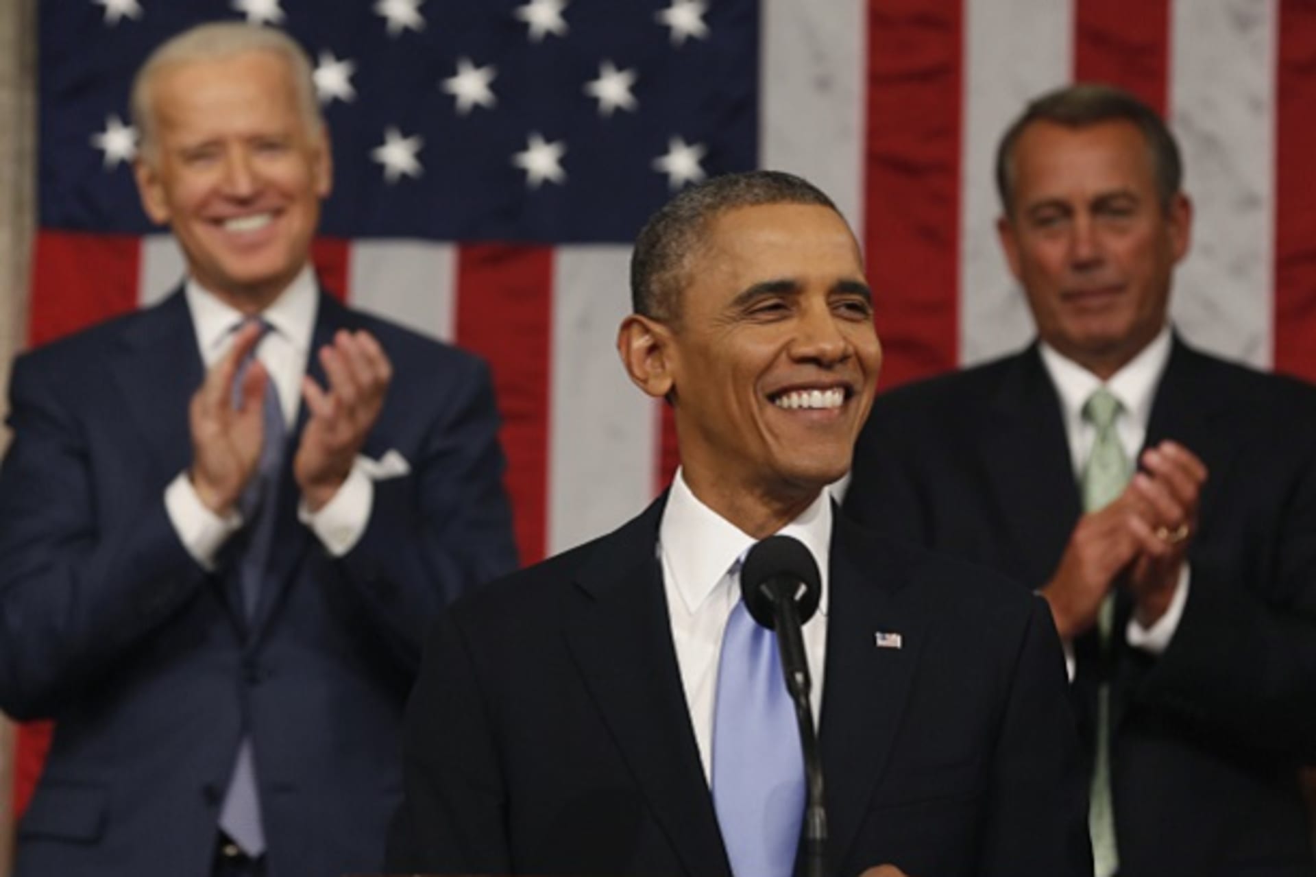 Vice President Biden and Speaker of the House Boehner applaud as President Obama finishes his State of the Union speech on Capitol Hill in Washington