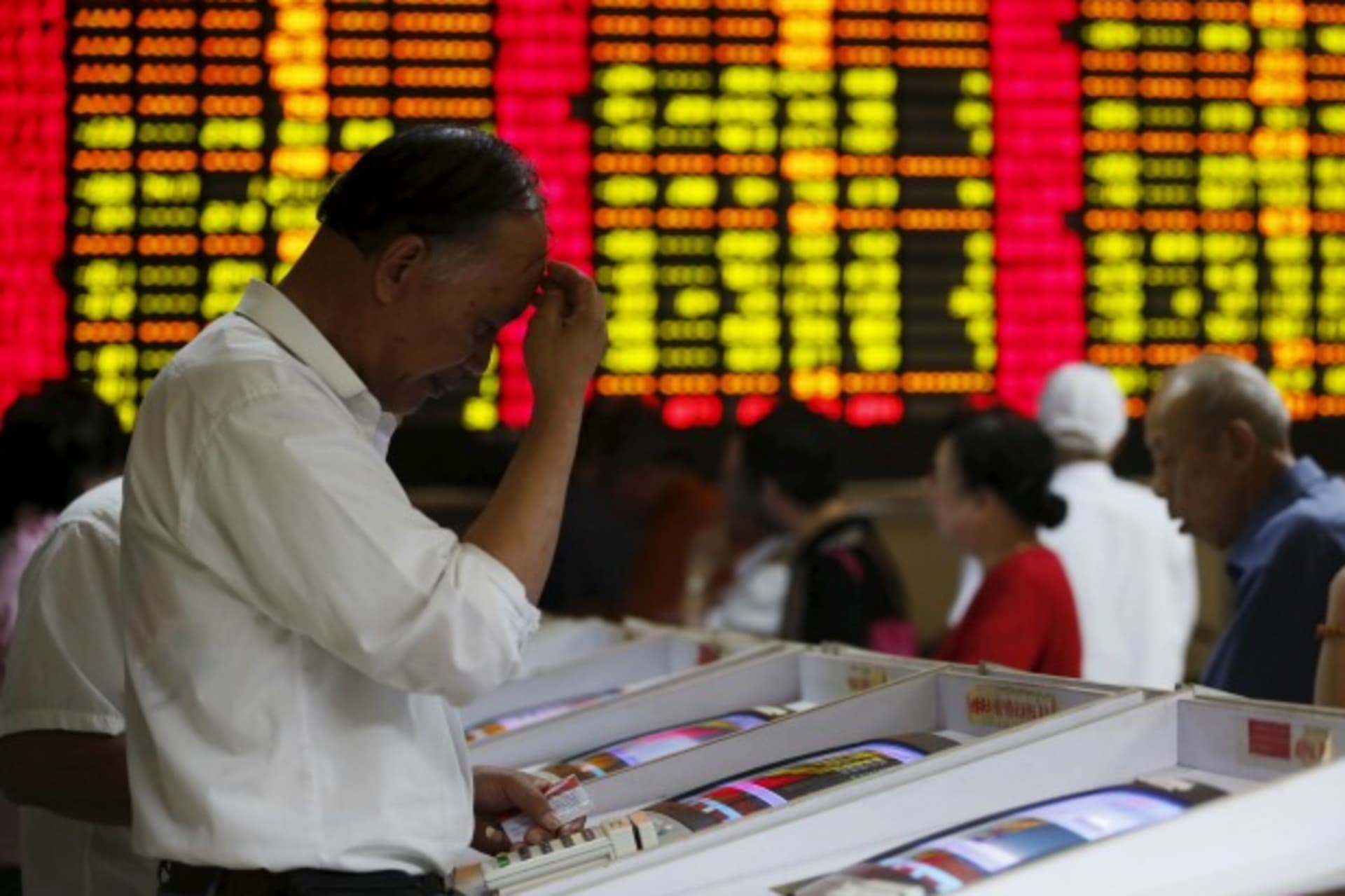 <p>Investors look at computer screens showing stock information at a brokerage house in Shanghai, China, July 8, 2015. Chinese st…economy was in the grip of “panic sentiment” as investors ignored a battery of support measures from Beijing. REUTERS/Aly Song</p>

