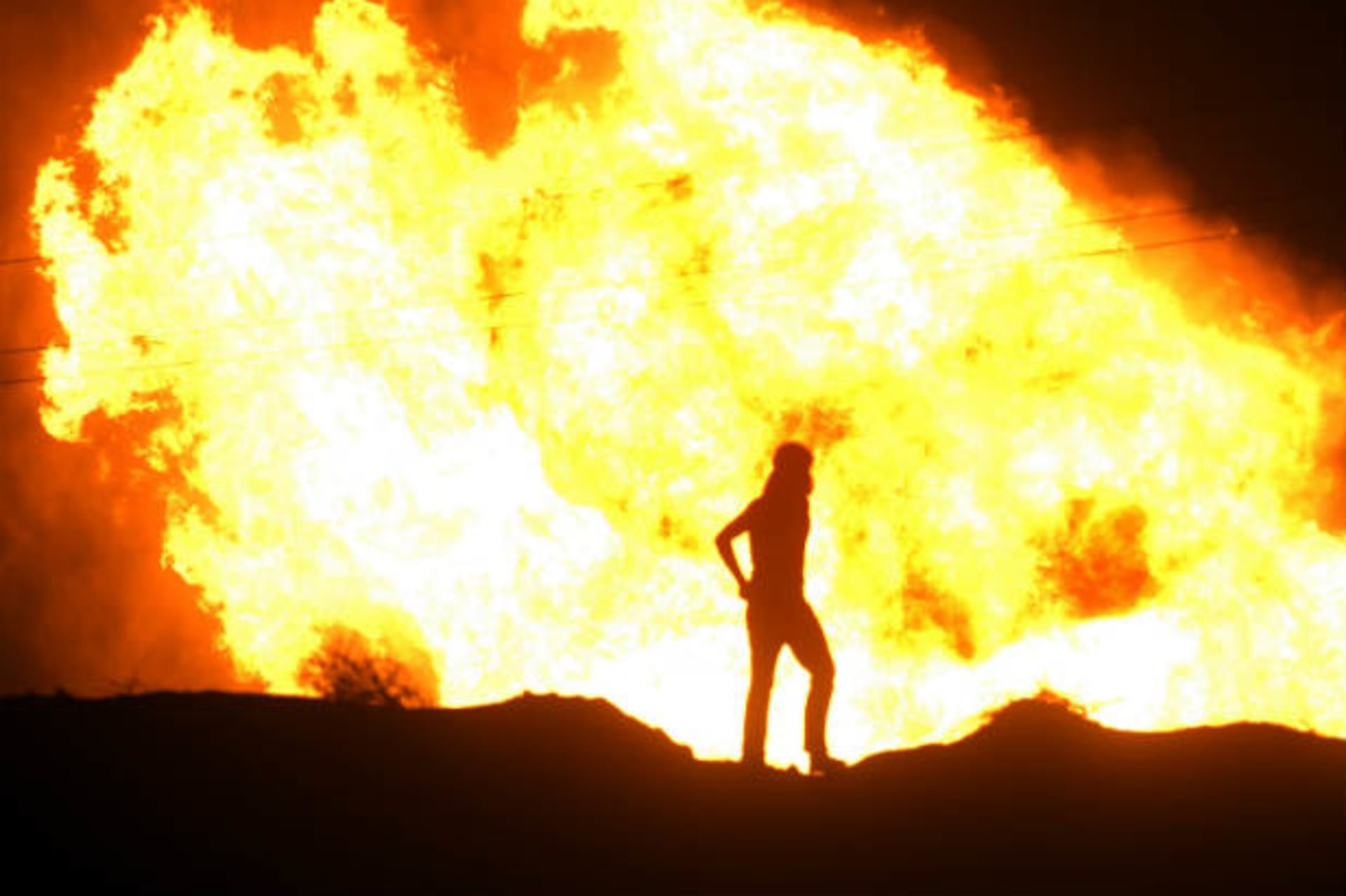 Flames rise from an Egyptian pipeline distribution station after an attack in the Sinai peninsula July 12, 2011 (Courtesy Reuters).