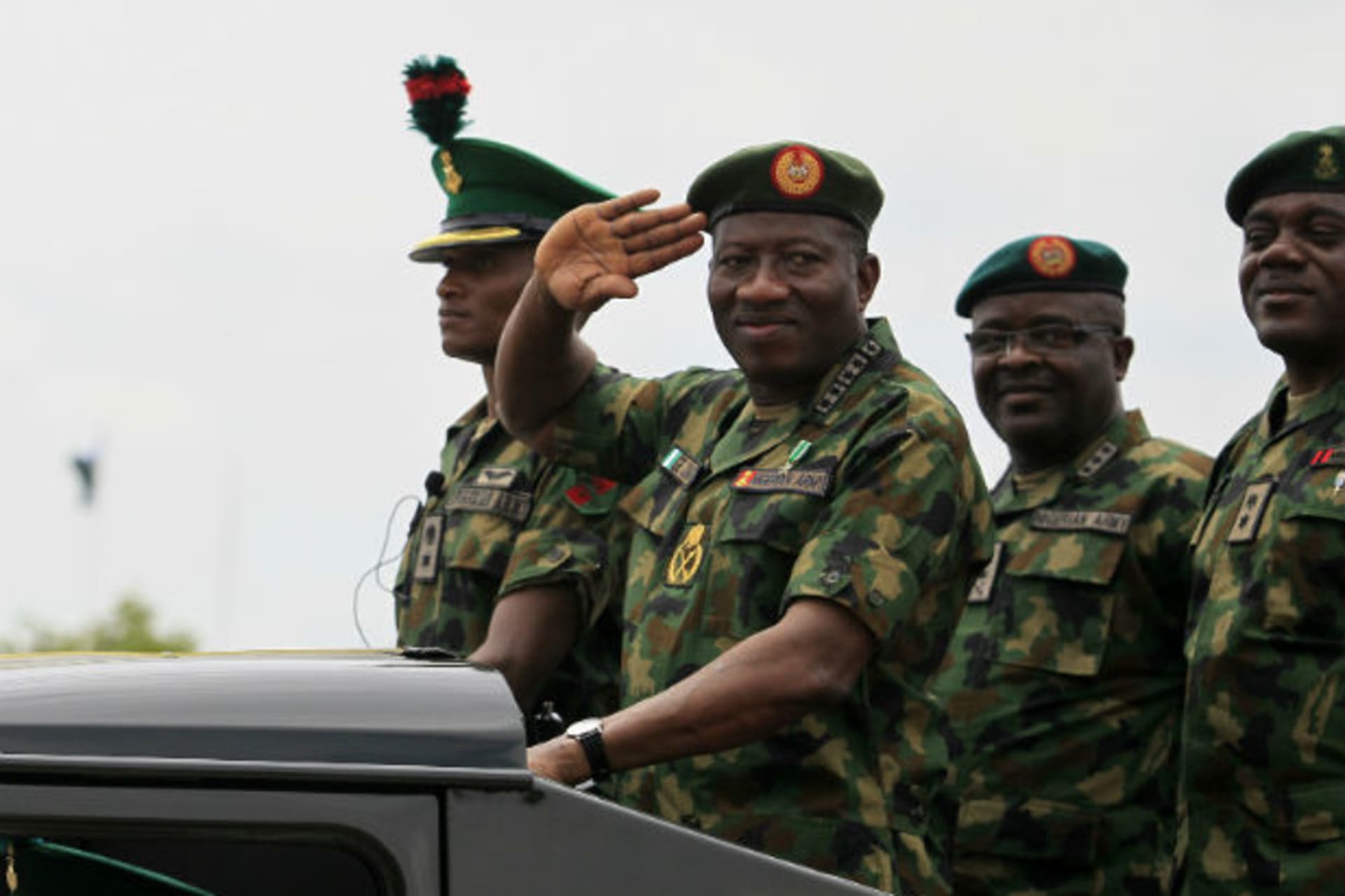 Nigeria's President Goodluck Jonathan salutes as he parades during the Nigeria Army's 150th anniversary celebration in Abuja July 6, 2013.