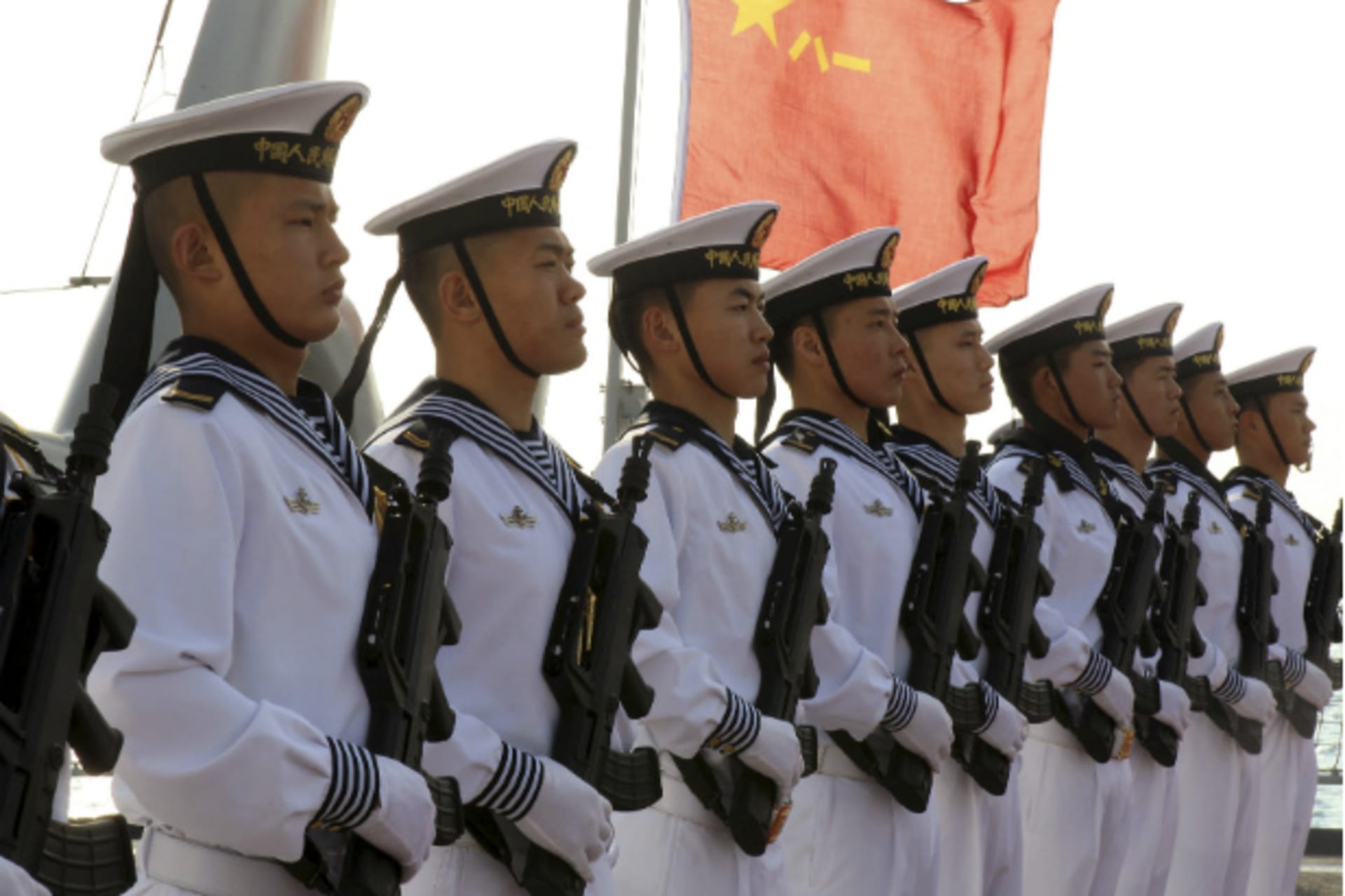 <p>Chinese sailors stand at attention on the helipad of the Chinese frigate Yancheng docked at Limassol port on January 4, 2014. (Andreas Manolis/Courtesy Reuters)</p>
