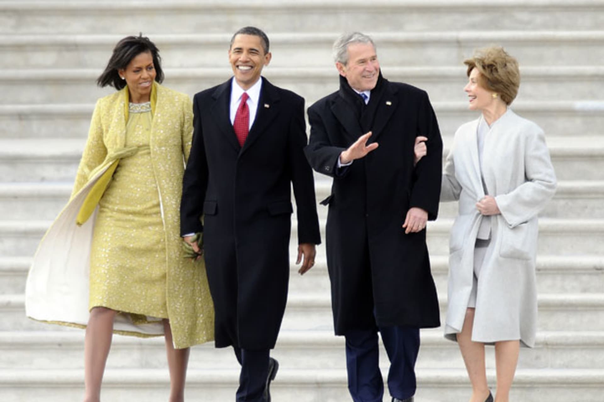 <p>President Barack Obama and First Lady Michelle Obama walk out to the presidential helicopter with former President George W. Bush and his wife Laura after President Obama’s inauguration in 2009. (Tannen Maury/Reuters)</p>