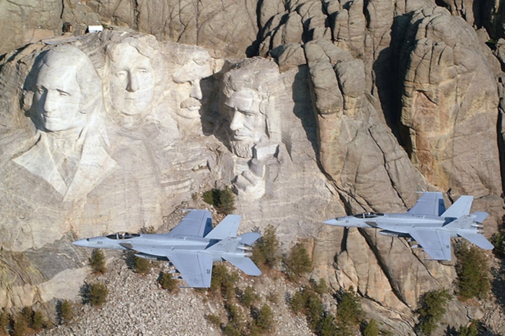 <p>U.S. Navy F/A-18E Super Hornets fly by Mount Rushmore. (Lt. Anthony Dobson/U.S. Navy Handout/Courtesy Reuters)</p>
