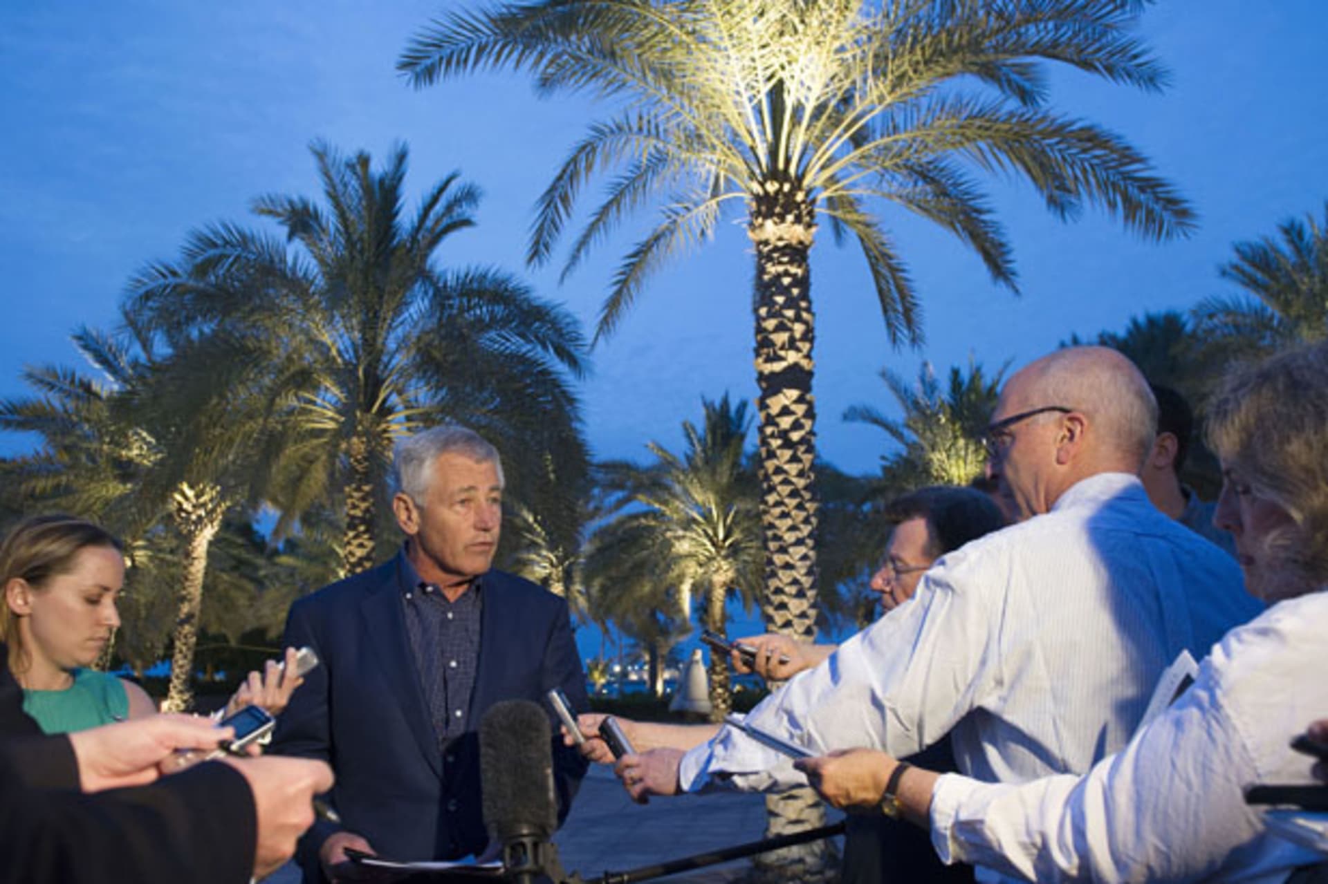 <p>U.S. secretary of defense Chuck Hagel speaks with reporters in Abu Dhabi after reading a statement on chemical weapon use in Syria (Jim Watson/Courtesy Reuters).</p>
