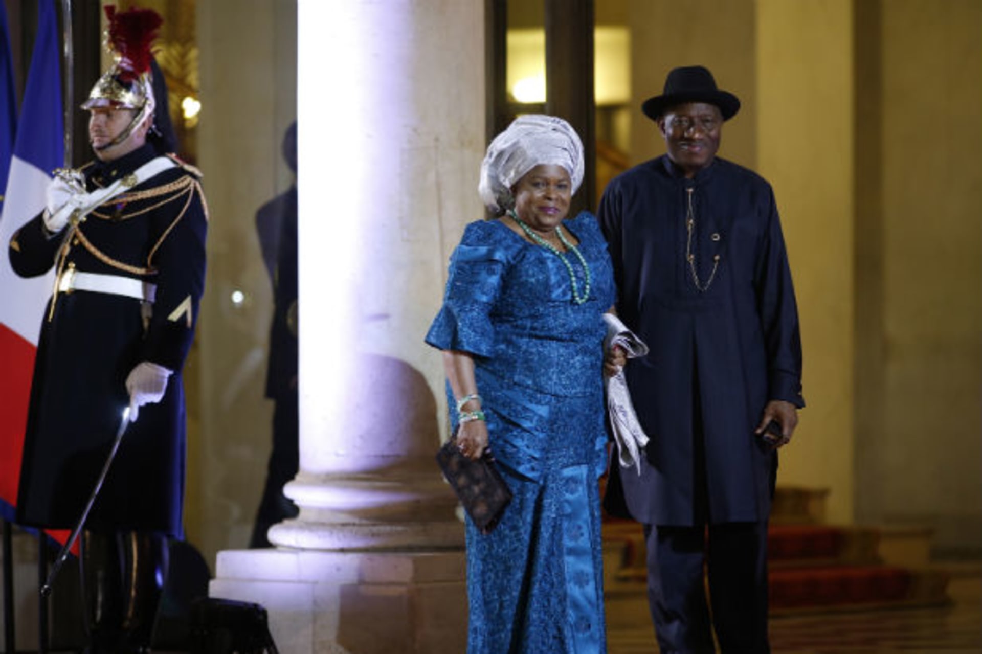 Nigeria's President Goodluck Jonathan and his wife Patience arrive for a dinner with the French President and other dignitaries as part of the Summit for Peace and Security in Africa at the Elysee Palace in Paris, December 6, 2013.