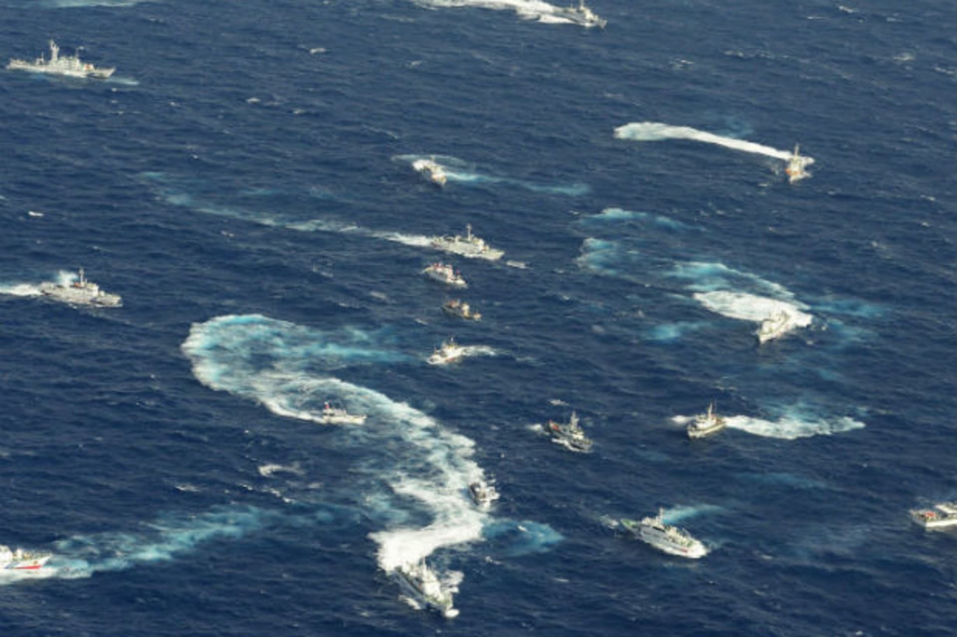 <p>An aerial view shows Japan Coast Guard patrol ship, fishing boats from Taiwan and Taiwan’s Coast Guard vessel sailing side by side near the disputed islands in the East China Sea. (Kyodo/Courtesy Reuters).</p>
