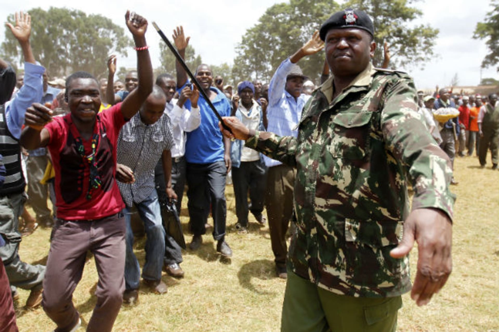 THIKA, Kenya A policeman controls supporters of Kenya's Prime Minister Raila Odinga, presidential candidate of the Coalition for Reforms and Democracy (CORD), during Odinga's campaign rally in Thika town, 40 km (25 miles) from Nairobi, February