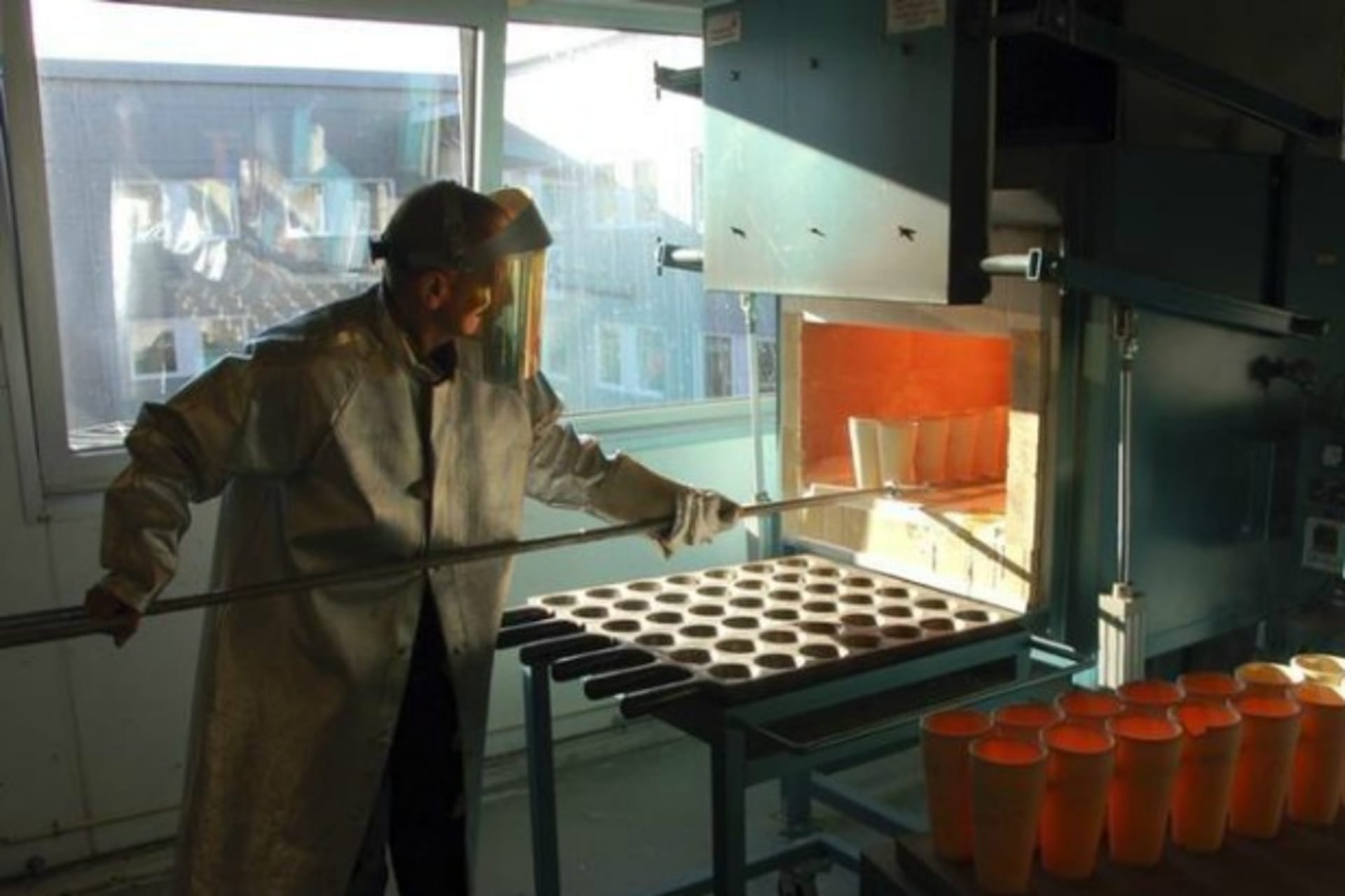 <p>A lab manager at Activation laboratories prepares samples of mines to check ore grades of minerals in Nuuk, Greenland, on October 15, 2012.</p>
