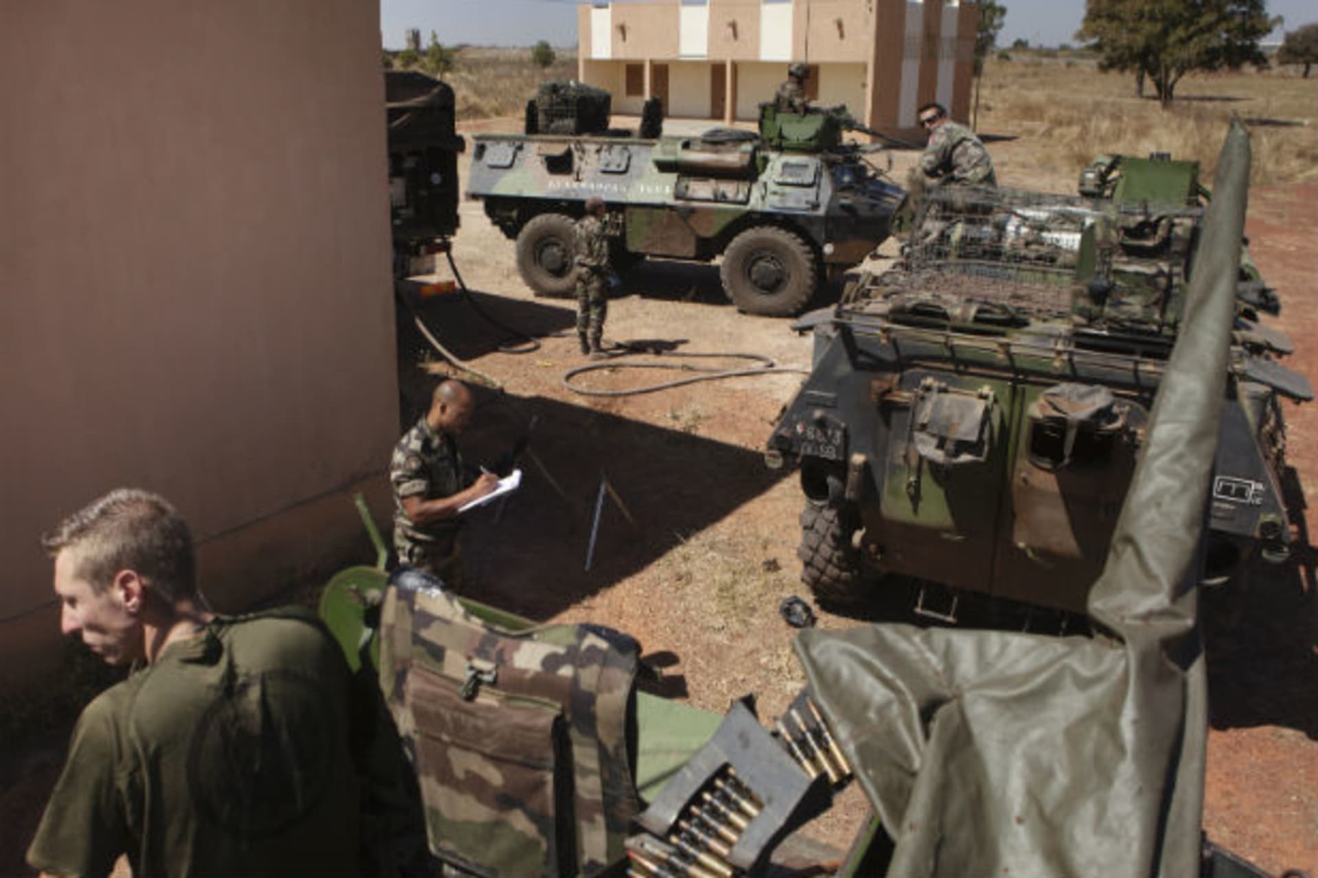 French soldiers refuel Armoured Personnel Carriers that were driven from Ivory Coast, at a Malian air base in Bamako 15/01/2013.